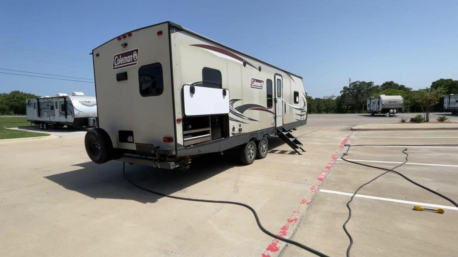 2019 KEYSTONE COLEMAN 2825RK (4YDT28226KM) , Length: 32.92 ft. | Dry Weight: 6,522 lbs. | Slides: 1 transmission, located at 4319 N Main Street, Cleburne, TX, 76033, (817) 221-0660, 32.435829, -97.384178 - The 2019 Keystone Coleman 2825RK is intended for comfort and convenience. It measures 32.92 feet long and weighs 6,522 pounds dry. It has a single slide-out that greatly increases the inside room. The outside, streamlined with a clean, neutral color palette highlighted with red and black graphics, p - Photo#1