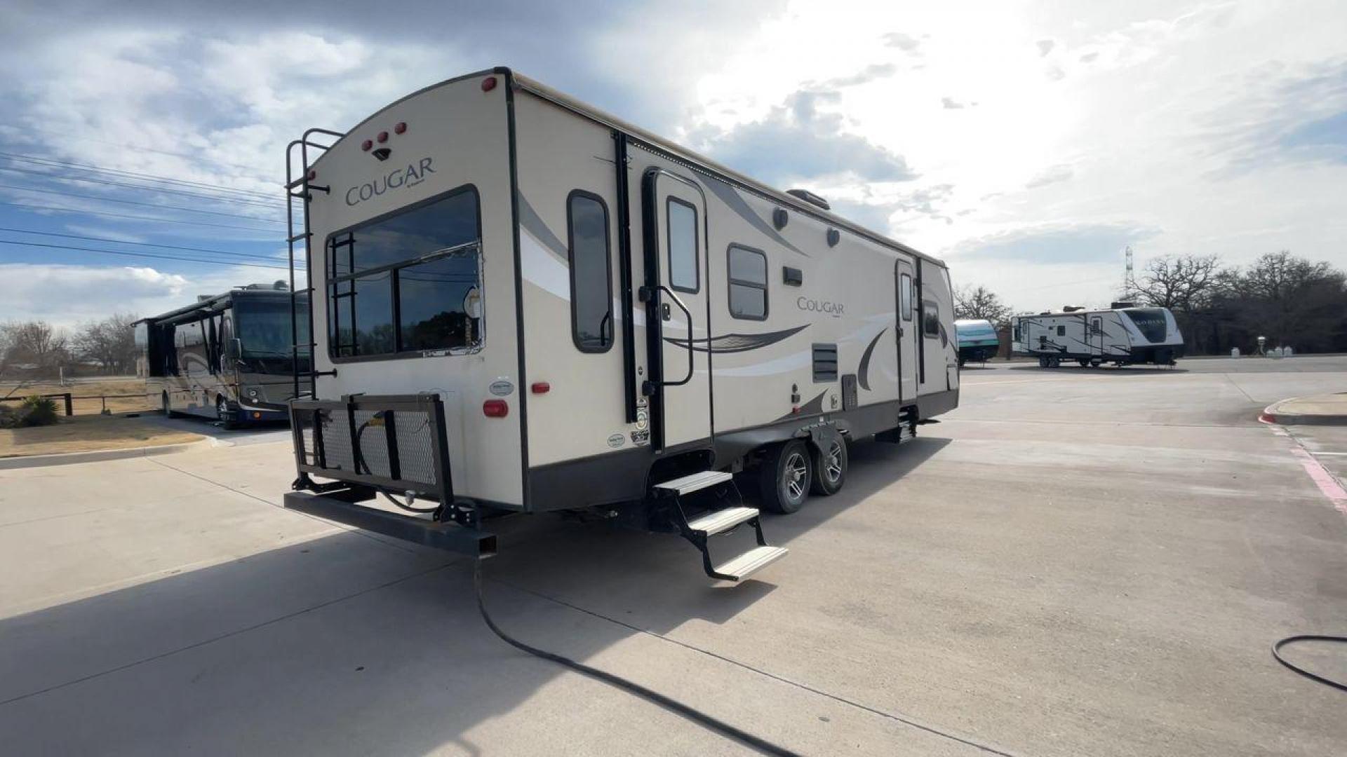 2019 TAN KEYSTONE COUGAR 29RLD (4YDT29R22JV) , Length: 34 ft. | Dry Weight: 7,380 lbs. | Gross Weight: 9,560 lbs. | Slides: 2 transmission, located at 4319 N Main Street, Cleburne, TX, 76033, (817) 221-0660, 32.435829, -97.384178 - The 2019 Keystone Cougar 29RLD is a dual-axle aluminum wheel set-up measuring exactly 34 ft. in length. It has a dry weight of 7,380 lbs. and a GVWR of 9,560 lbs. Its exterior is a base color of tan with black and white accents. It comes with automatic heating and cooling rated at 35,000 and 15,000 - Photo#1