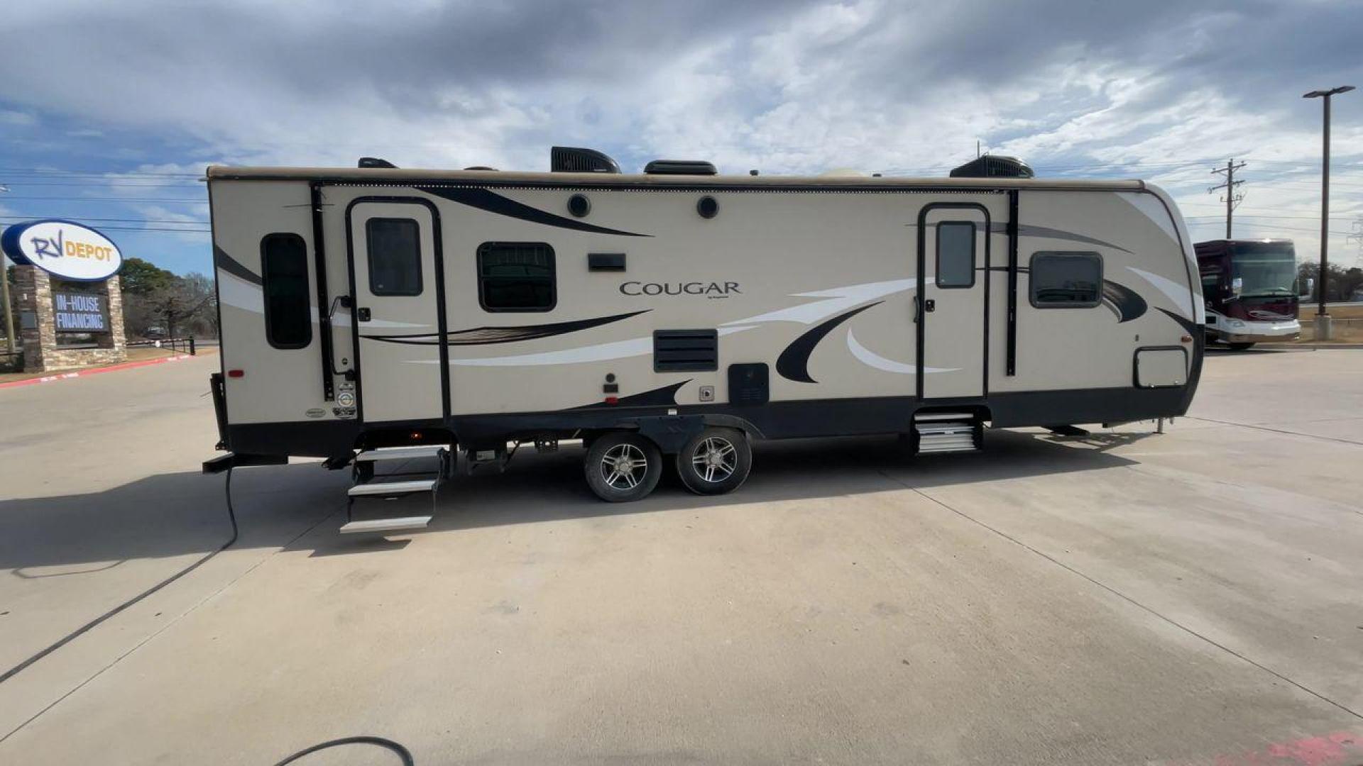 2019 TAN KEYSTONE COUGAR 29RLD (4YDT29R22JV) , Length: 34 ft. | Dry Weight: 7,380 lbs. | Gross Weight: 9,560 lbs. | Slides: 2 transmission, located at 4319 N Main Street, Cleburne, TX, 76033, (817) 221-0660, 32.435829, -97.384178 - The 2019 Keystone Cougar 29RLD is a dual-axle aluminum wheel set-up measuring exactly 34 ft. in length. It has a dry weight of 7,380 lbs. and a GVWR of 9,560 lbs. Its exterior is a base color of tan with black and white accents. It comes with automatic heating and cooling rated at 35,000 and 15,000 - Photo#2