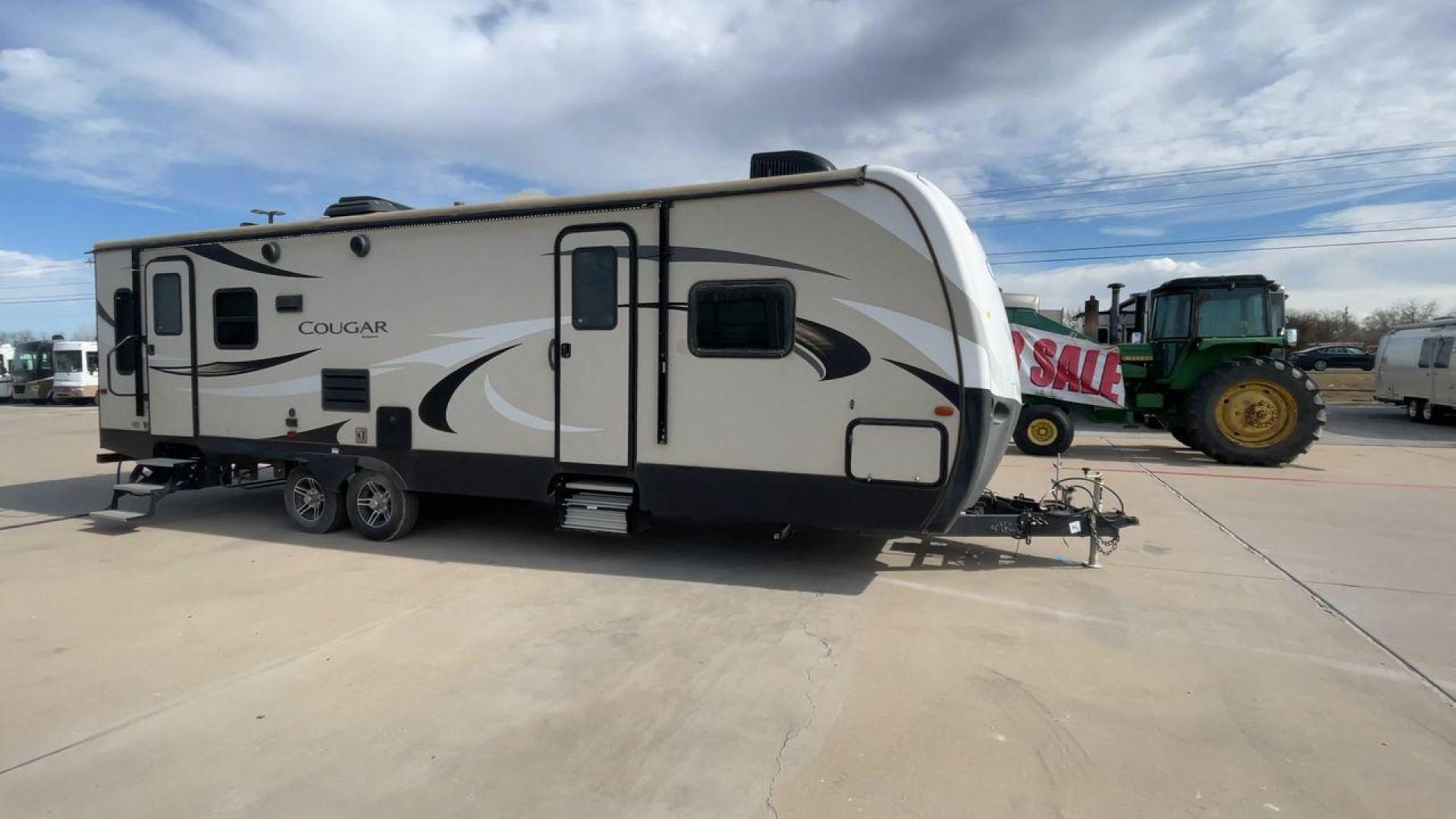 2019 TAN KEYSTONE COUGAR 29RLD (4YDT29R22JV) , Length: 34 ft. | Dry Weight: 7,380 lbs. | Gross Weight: 9,560 lbs. | Slides: 2 transmission, located at 4319 N Main Street, Cleburne, TX, 76033, (817) 221-0660, 32.435829, -97.384178 - The 2019 Keystone Cougar 29RLD is a dual-axle aluminum wheel set-up measuring exactly 34 ft. in length. It has a dry weight of 7,380 lbs. and a GVWR of 9,560 lbs. Its exterior is a base color of tan with black and white accents. It comes with automatic heating and cooling rated at 35,000 and 15,000 - Photo#3