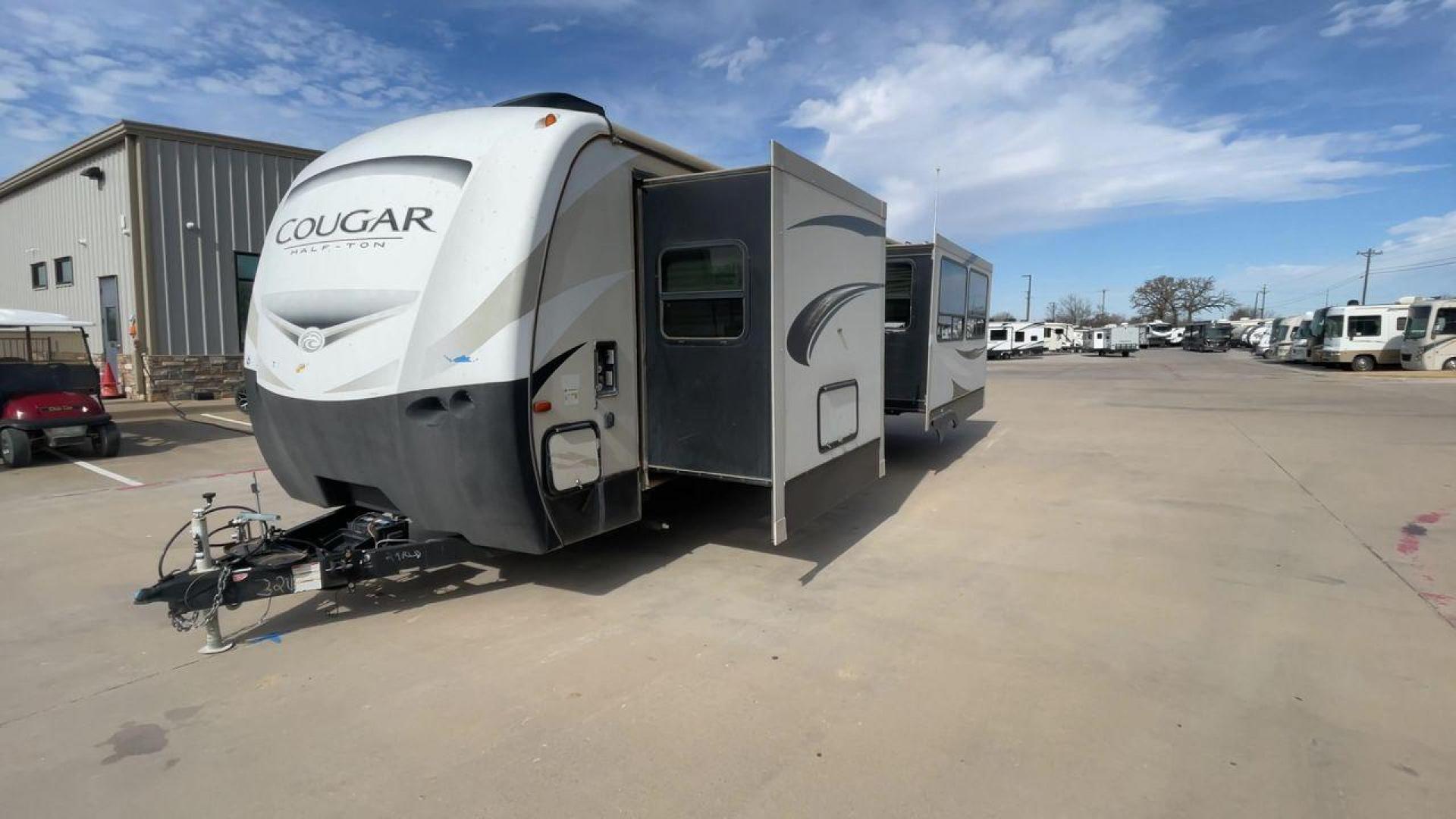 2019 TAN KEYSTONE COUGAR 29RLD (4YDT29R22JV) , Length: 34 ft. | Dry Weight: 7,380 lbs. | Gross Weight: 9,560 lbs. | Slides: 2 transmission, located at 4319 N Main Street, Cleburne, TX, 76033, (817) 221-0660, 32.435829, -97.384178 - The 2019 Keystone Cougar 29RLD is a dual-axle aluminum wheel set-up measuring exactly 34 ft. in length. It has a dry weight of 7,380 lbs. and a GVWR of 9,560 lbs. Its exterior is a base color of tan with black and white accents. It comes with automatic heating and cooling rated at 35,000 and 15,000 - Photo#5