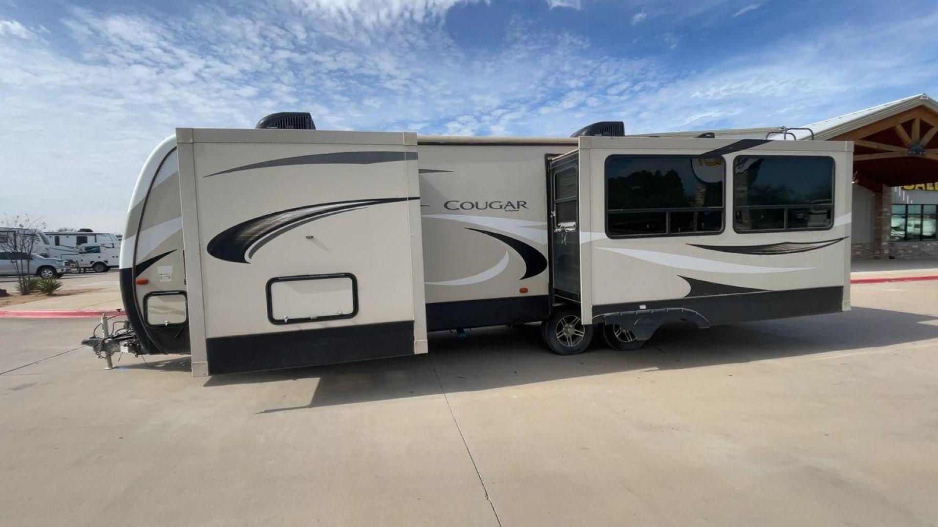 2019 TAN KEYSTONE COUGAR 29RLD (4YDT29R22JV) , Length: 34 ft. | Dry Weight: 7,380 lbs. | Gross Weight: 9,560 lbs. | Slides: 2 transmission, located at 4319 N Main Street, Cleburne, TX, 76033, (817) 221-0660, 32.435829, -97.384178 - The 2019 Keystone Cougar 29RLD is a dual-axle aluminum wheel set-up measuring exactly 34 ft. in length. It has a dry weight of 7,380 lbs. and a GVWR of 9,560 lbs. Its exterior is a base color of tan with black and white accents. It comes with automatic heating and cooling rated at 35,000 and 15,000 - Photo#6