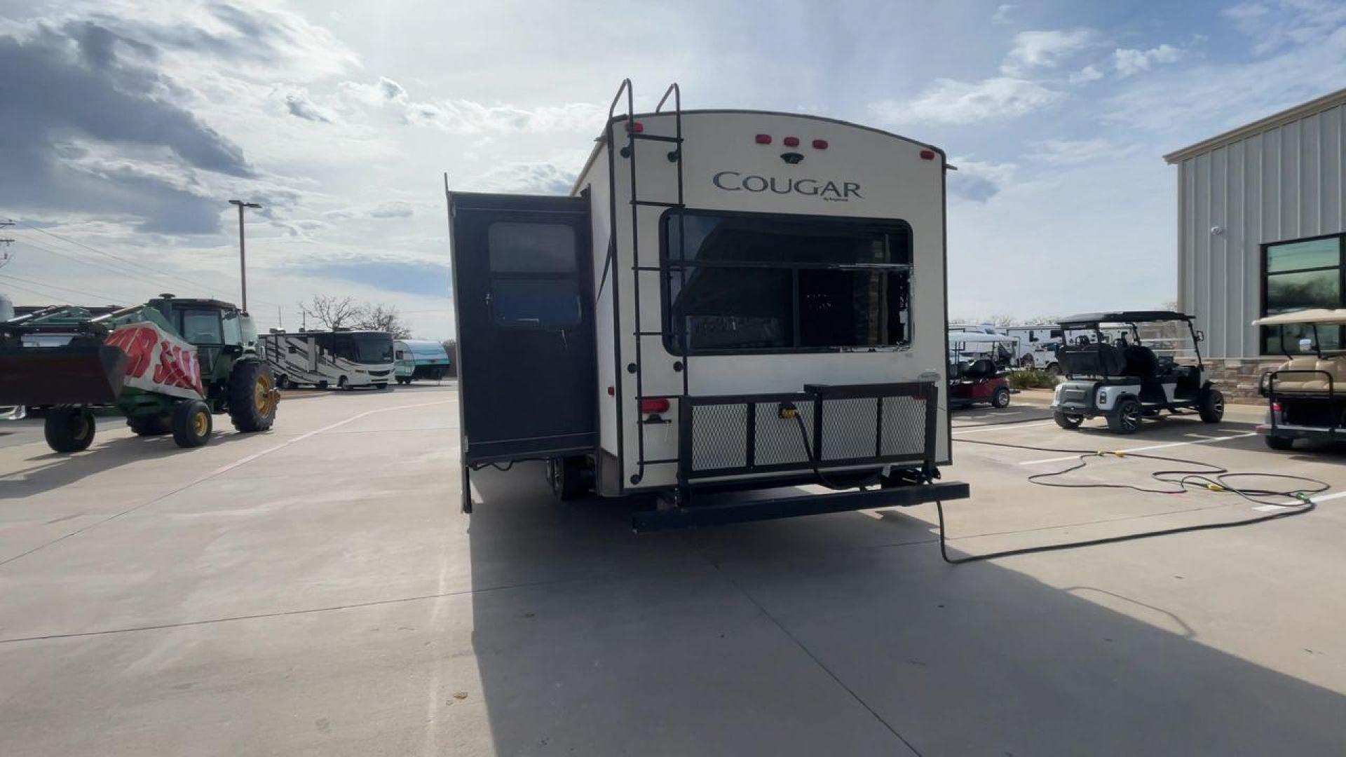 2019 TAN KEYSTONE COUGAR 29RLD (4YDT29R22JV) , Length: 34 ft. | Dry Weight: 7,380 lbs. | Gross Weight: 9,560 lbs. | Slides: 2 transmission, located at 4319 N Main Street, Cleburne, TX, 76033, (817) 221-0660, 32.435829, -97.384178 - The 2019 Keystone Cougar 29RLD is a dual-axle aluminum wheel set-up measuring exactly 34 ft. in length. It has a dry weight of 7,380 lbs. and a GVWR of 9,560 lbs. Its exterior is a base color of tan with black and white accents. It comes with automatic heating and cooling rated at 35,000 and 15,000 - Photo#8