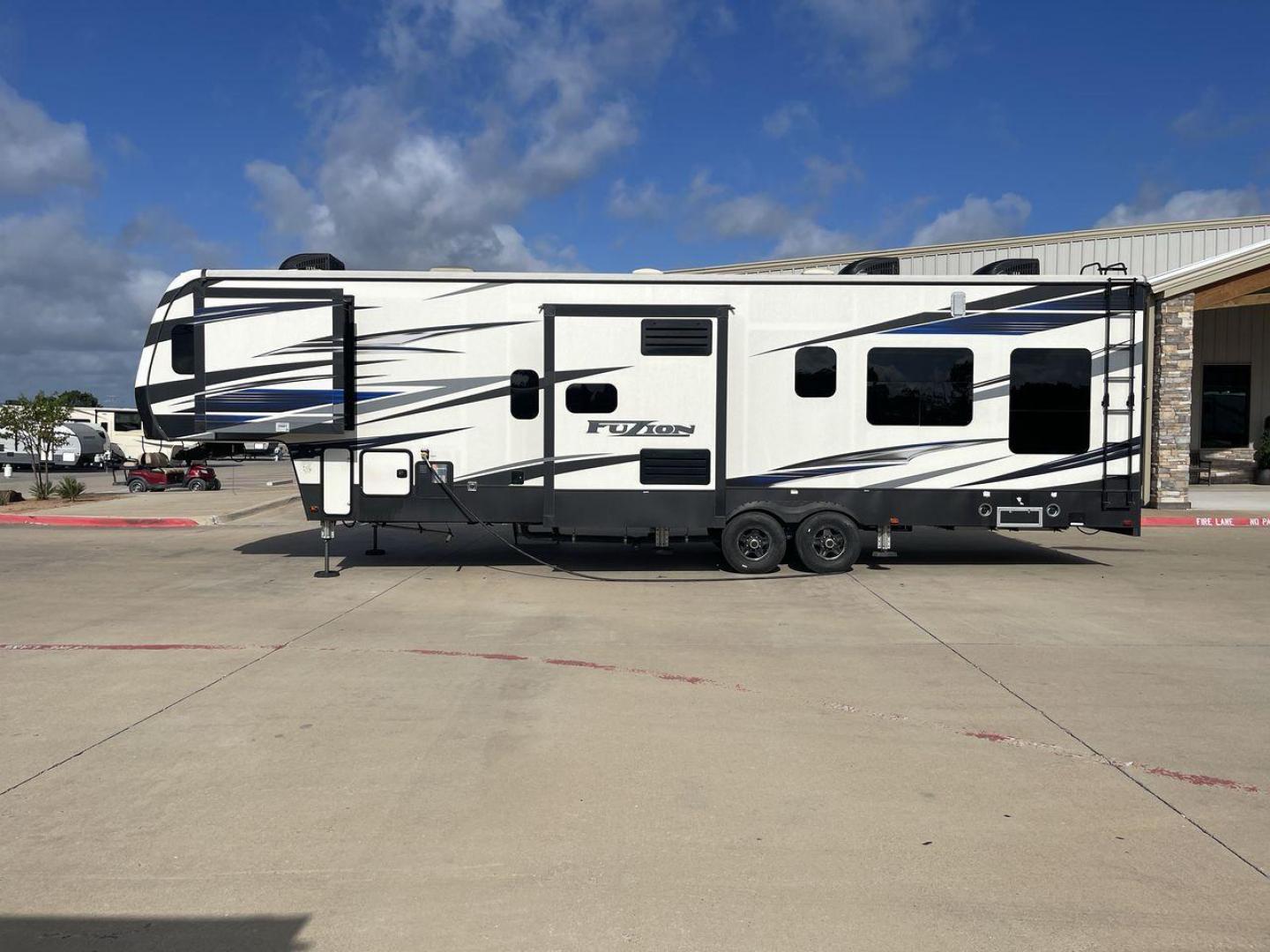 2019 KEYSTONE FUZION 373 (4YDF37322KF) , Length: 39 ft. | Dry Weight: 13,920 lbs. | Gross Weight: 17,000 lbs. | Slides: 3 transmission, located at 4319 N Main Street, Cleburne, TX, 76033, (817) 221-0660, 32.435829, -97.384178 - The 2019 Keystone Fuzion 373 is an impressive 39-foot toy hauler designed for adventurous travelers. With a dry weight of 13,920 lbs and a gross weight of 17,000 lbs, this RV combines rugged capabilities with luxurious living spaces. Featuring three slides, the Fuzion 373 offers a spacious interior - Photo#24