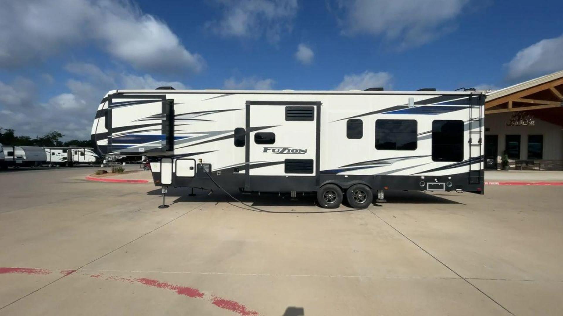 2019 KEYSTONE FUZION 373 (4YDF37322KF) , Length: 39 ft. | Dry Weight: 13,920 lbs. | Gross Weight: 17,000 lbs. | Slides: 3 transmission, located at 4319 N Main Street, Cleburne, TX, 76033, (817) 221-0660, 32.435829, -97.384178 - The 2019 Keystone Fuzion 373 is an impressive 39-foot toy hauler designed for adventurous travelers. With a dry weight of 13,920 lbs and a gross weight of 17,000 lbs, this RV combines rugged capabilities with luxurious living spaces. Featuring three slides, the Fuzion 373 offers a spacious interior - Photo#6