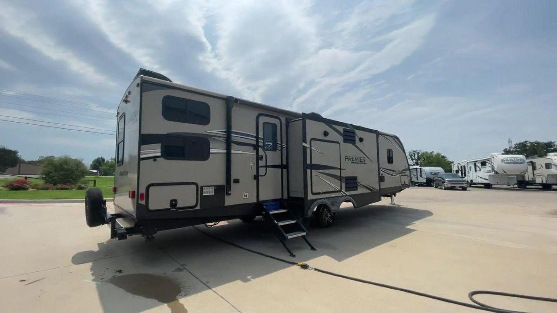 2019 KEYSTONE PREMIER 34BIPR (4YDT34B27KD) , Length: 38.25 ft. | Dry Weight: 7,495 lbs. | Gross Weight: 9,400 lbs. | Slides: 3 transmission, located at 4319 N Main Street, Cleburne, TX, 76033, (817) 221-0660, 32.435829, -97.384178 - The exterior of this used 2019 Keystone Premiere 34RIPR travel trailer features a streamlined and modern design with a grey and beige color scheme complemented by black and white accents. It is labeled as the Premier Ultra Lite by Keystone to emphasize its lightweight nature and ease of towing. The - Photo#1