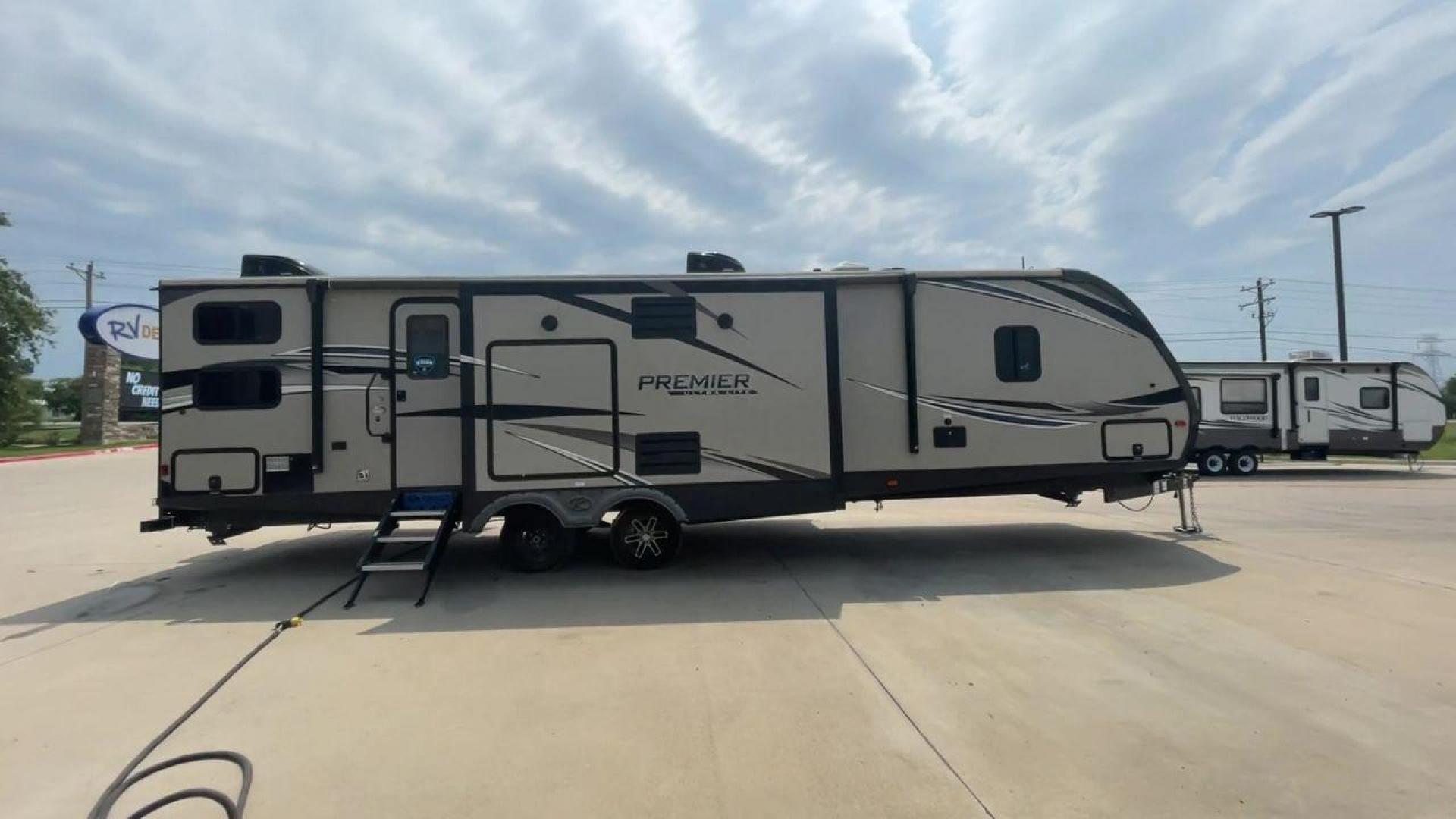 2019 KEYSTONE PREMIER 34BIPR (4YDT34B27KD) , Length: 38.25 ft. | Dry Weight: 7,495 lbs. | Gross Weight: 9,400 lbs. | Slides: 3 transmission, located at 4319 N Main Street, Cleburne, TX, 76033, (817) 221-0660, 32.435829, -97.384178 - The exterior of this used 2019 Keystone Premiere 34RIPR travel trailer features a streamlined and modern design with a grey and beige color scheme complemented by black and white accents. It is labeled as the Premier Ultra Lite by Keystone to emphasize its lightweight nature and ease of towing. The - Photo#2