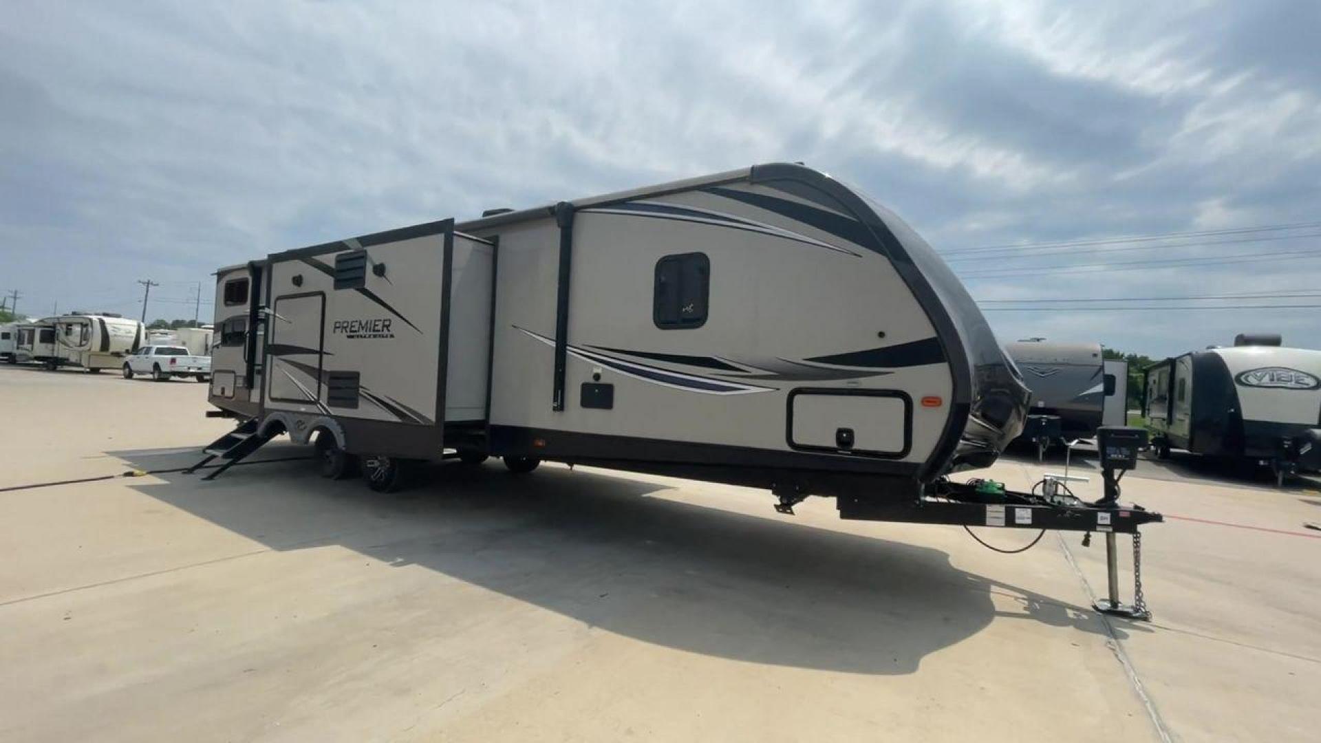 2019 KEYSTONE PREMIER 34BIPR (4YDT34B27KD) , Length: 38.25 ft. | Dry Weight: 7,495 lbs. | Gross Weight: 9,400 lbs. | Slides: 3 transmission, located at 4319 N Main Street, Cleburne, TX, 76033, (817) 221-0660, 32.435829, -97.384178 - The exterior of this used 2019 Keystone Premiere 34RIPR travel trailer features a streamlined and modern design with a grey and beige color scheme complemented by black and white accents. It is labeled as the Premier Ultra Lite by Keystone to emphasize its lightweight nature and ease of towing. The - Photo#3