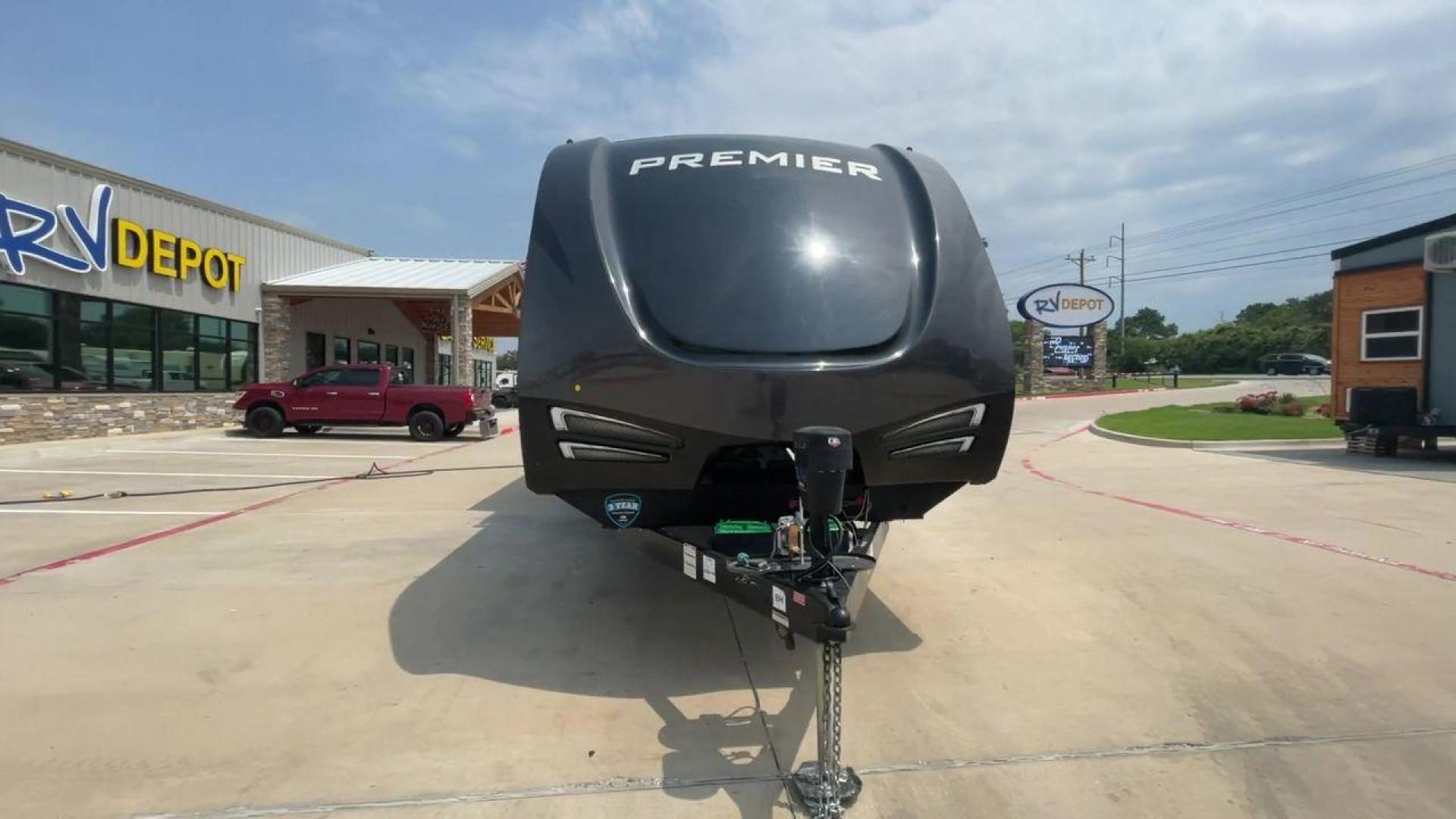 2019 KEYSTONE PREMIER 34BIPR (4YDT34B27KD) , Length: 38.25 ft. | Dry Weight: 7,495 lbs. | Gross Weight: 9,400 lbs. | Slides: 3 transmission, located at 4319 N Main Street, Cleburne, TX, 76033, (817) 221-0660, 32.435829, -97.384178 - The exterior of this used 2019 Keystone Premiere 34RIPR travel trailer features a streamlined and modern design with a grey and beige color scheme complemented by black and white accents. It is labeled as the Premier Ultra Lite by Keystone to emphasize its lightweight nature and ease of towing. The - Photo#4