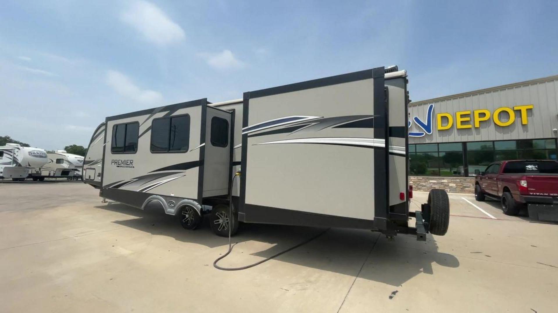 2019 KEYSTONE PREMIER 34BIPR (4YDT34B27KD) , Length: 38.25 ft. | Dry Weight: 7,495 lbs. | Gross Weight: 9,400 lbs. | Slides: 3 transmission, located at 4319 N Main Street, Cleburne, TX, 76033, (817) 221-0660, 32.435829, -97.384178 - The exterior of this used 2019 Keystone Premiere 34RIPR travel trailer features a streamlined and modern design with a grey and beige color scheme complemented by black and white accents. It is labeled as the Premier Ultra Lite by Keystone to emphasize its lightweight nature and ease of towing. The - Photo#7