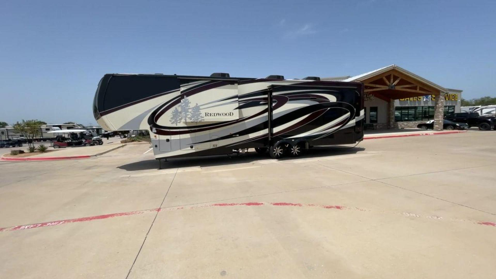 2019 KEYSTONE REDWOOD 3901WB (4YDF39023K9) , Length: 40.17 ft. | Dry Weight: 14,312 lbs. | Slides: 3 transmission, located at 4319 N Main Street, Cleburne, TX, 76033, (817) 221-0660, 32.435829, -97.384178 - The 2019 Keystone Redwood 3901WB is a high-end fifth-wheel RV that blends luxury living with home-like comfort. It's perfect for long trips or full-time living. Its outside has a high-gloss paint job in black and white colors, with the Redwood tree graphics that make it stand out. This RV is over 40 - Photo#5