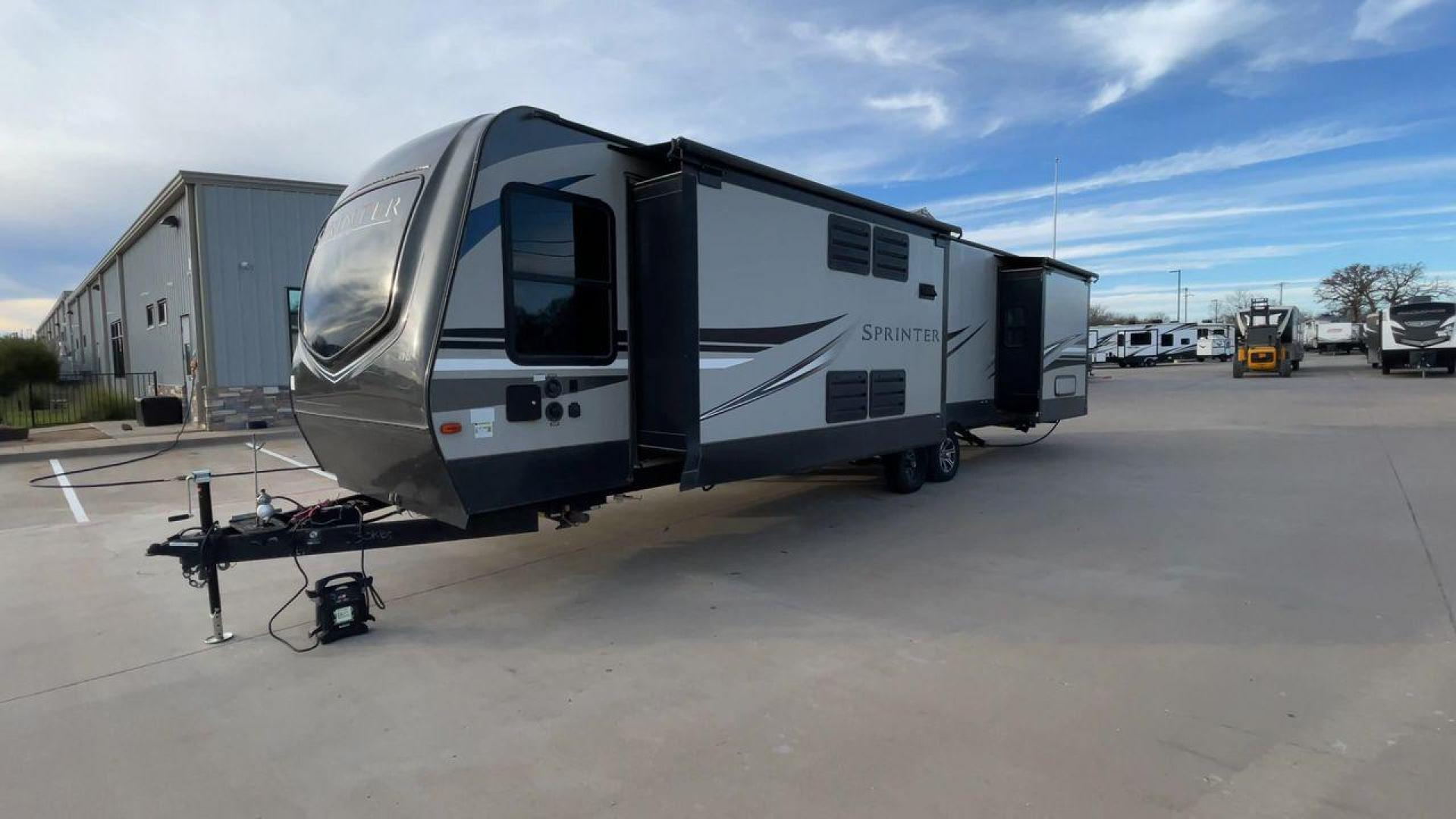 2019 KEYSTONE SPRINTER 330KBS (4YDT33021K1) , Length: 37.75 ft. | Dry Weight: 9,100 lbs. | Gross Weight: 11,500 lbs. | Slides: 3 transmission, located at 4319 N Main Street, Cleburne, TX, 76033, (817) 221-0660, 32.435829, -97.384178 - The 2019 Keystone Sprinter 330KBS travel trailer is a spacious and well-designed unit, measuring 37.75 feet in length. The exterior is sleek and modern, featuring a gray and white color scheme accented by black and blue graphic lines. The trailer has three (3) slideouts, providing ample space for c - Photo#5