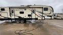 2019 KZ DURANGO GOLD 292BHT (4EZFD2925K6) , Length: 35 ft | Gross Weight: 11,500 lbs | Slides: 3 transmission, located at 4319 N Main Street, Cleburne, TX, 76033, (817) 221-0660, 32.435829, -97.384178 - At 35 ft. long, this 2019 KZ Durango 1500 292BHT fifth wheel RV showcases a striking two-tone cream and black color scheme accented with bold, swooping graphics in shades of gray and burgundy. The front cap features a sleek, aerodynamic design with the "Durango 1500" branding and mountain graphic. A - Photo#2