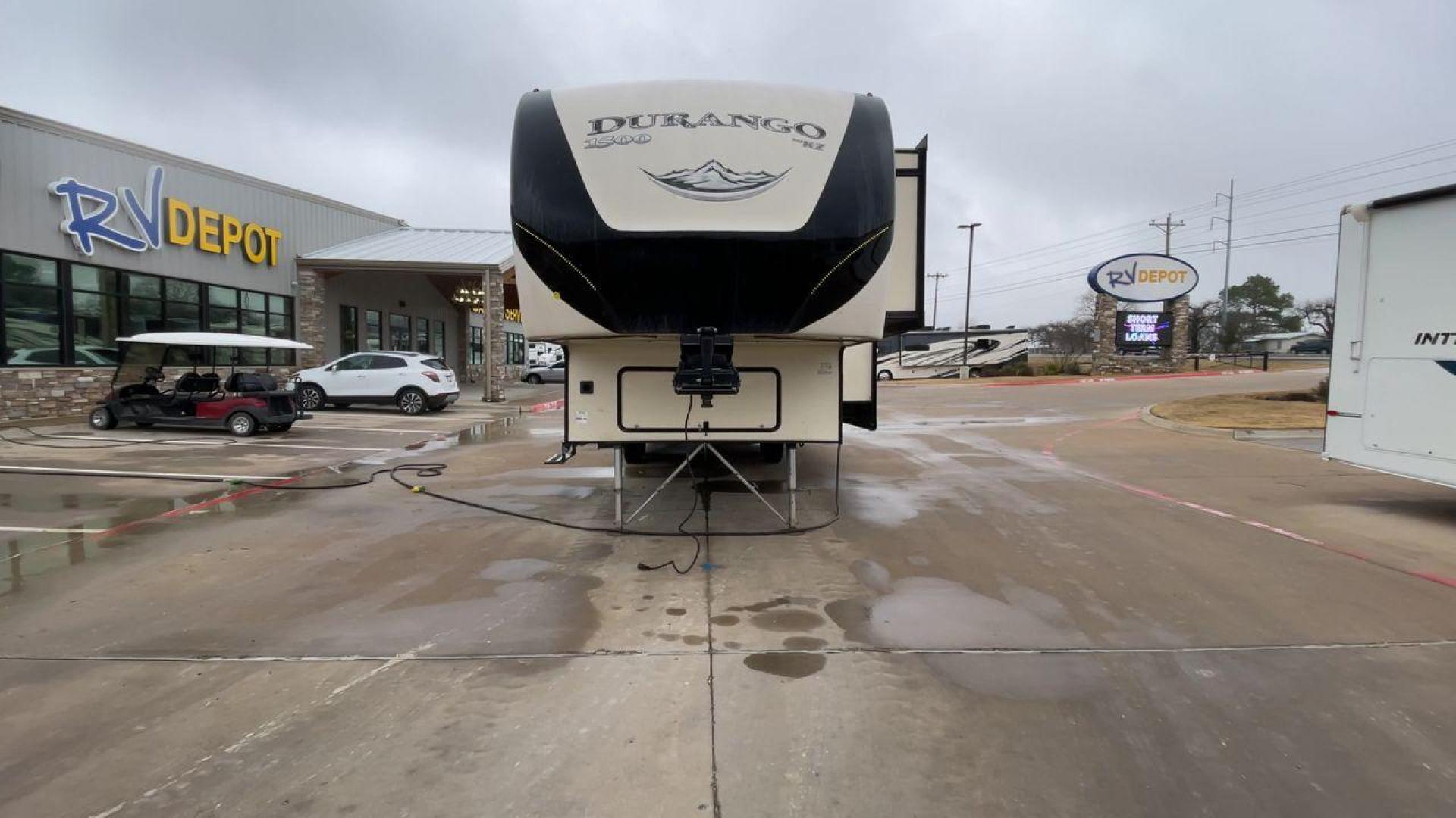 2019 KZ DURANGO GOLD 292BHT (4EZFD2925K6) , Length: 35 ft | Gross Weight: 11,500 lbs | Slides: 3 transmission, located at 4319 N Main Street, Cleburne, TX, 76033, (817) 221-0660, 32.435829, -97.384178 - At 35 ft. long, this 2019 KZ Durango 1500 292BHT fifth wheel RV showcases a striking two-tone cream and black color scheme accented with bold, swooping graphics in shades of gray and burgundy. The front cap features a sleek, aerodynamic design with the "Durango 1500" branding and mountain graphic. A - Photo#4