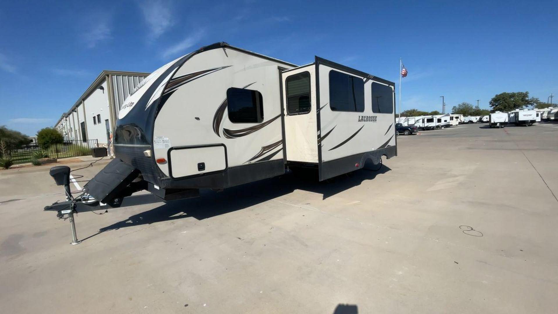 2019 TAN PRIME TIME LACROSSE 2911RB - (5ZT2LCUB3KB) , Length: 31.92 ft. | Dry Weight: 6,516 lbs. | Slides: 1 transmission, located at 4319 N Main Street, Cleburne, TX, 76033, (817) 221-0660, 32.435829, -97.384178 - This 2019 LaCrosse 2911RB travel trailer measures just a bit under 32' in length. It is a dual axle, aluminum wheel setup with a dry weight of 6,516 lbs and has a carrying capacity of 3,054 lbs. This LaCrosse has one slide. The rear of the trailer holds the bathroom, which has a standalone sink a - Photo#5