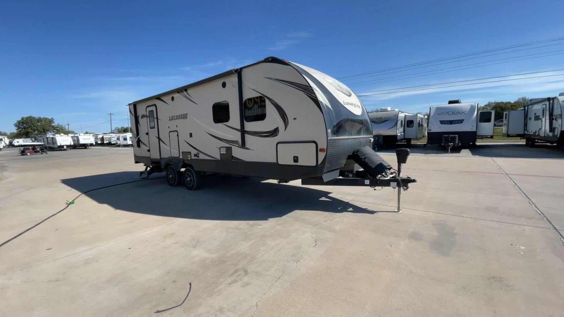 2019 TAN PRIME TIME LACROSSE 2911RB - (5ZT2LCUB3KB) , Length: 31.92 ft. | Dry Weight: 6,516 lbs. | Slides: 1 transmission, located at 4319 N Main Street, Cleburne, TX, 76033, (817) 221-0660, 32.435829, -97.384178 - This 2019 LaCrosse 2911RB travel trailer measures just a bit under 32' in length. It is a dual axle, aluminum wheel setup with a dry weight of 6,516 lbs and has a carrying capacity of 3,054 lbs. This LaCrosse has one slide. The rear of the trailer holds the bathroom, which has a standalone sink and - Photo#3