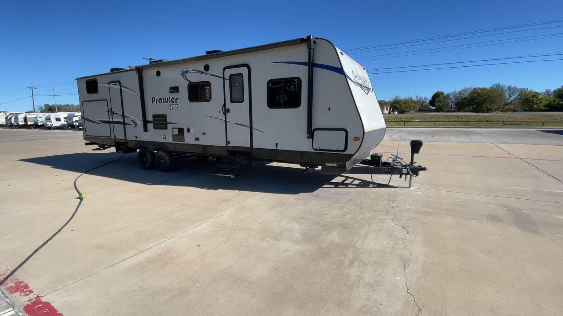 2019 GRAY PROWLER 32LX - (5SFPB3626KE) , Length: 36.33 ft. | Dry Weight: 7,540 lbs. | Slides: 2 transmission, located at 4319 N Main Street, Cleburne, TX, 76033, (817) 221-0660, 32.435829, -97.384178 - This 2019 Prowler 32LX is a dual-axle steel wheel setup measuring 36.33 ft. in length and 11.17 ft. in height. It has a dry weight of 7,540 lbs. and a hitch weight of 940 lbs. It features two doors, two slides, and one awning. This travel trailer is a bunkhouse model that can sleep up to 11 peopl - Photo#3