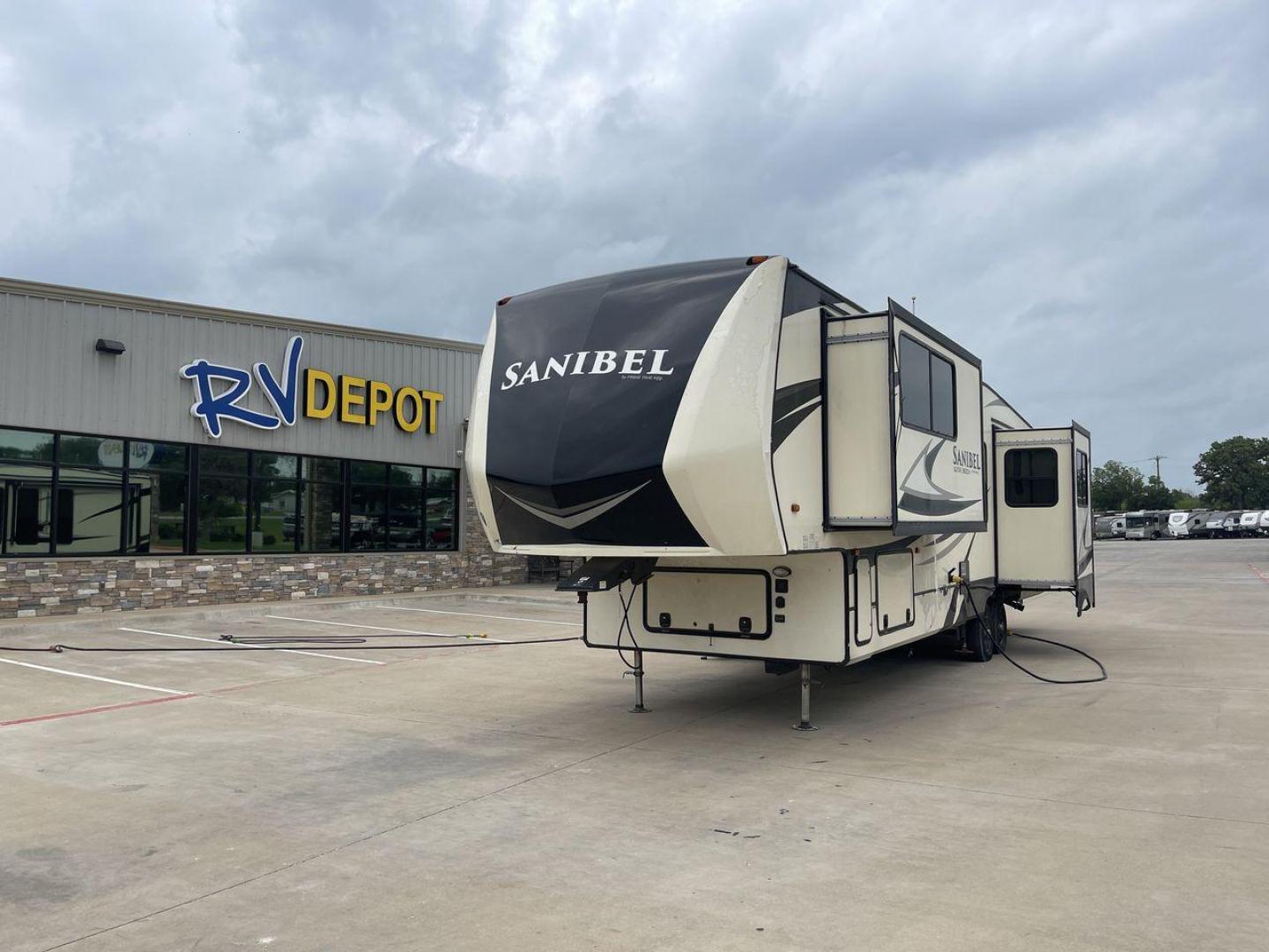 2019 TAN SANIBEL 3702WB (5ZT3SN2B6KG) , located at 4319 N Main Street, Cleburne, TX, 76033, (817) 221-0660, 32.435829, -97.384178 - The length of this 2019 Sanibel Fifth Wheel is just over 41 feet, and the width is just over 8 feet. It weighs 11,859 pounds when it's not hitched and 2,298 pounds when it is. The heater in this unit is listed at 40,000 BTUs, and it heats and cools itself automatically. This has a beautiful gray bas - Photo#0