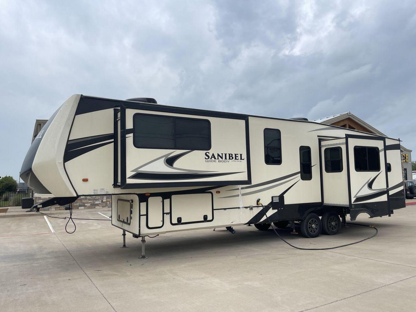 2019 TAN SANIBEL 3702WB (5ZT3SN2B6KG) , located at 4319 N Main Street, Cleburne, TX, 76033, (817) 221-0660, 32.435829, -97.384178 - The length of this 2019 Sanibel Fifth Wheel is just over 41 feet, and the width is just over 8 feet. It weighs 11,859 pounds when it's not hitched and 2,298 pounds when it is. The heater in this unit is listed at 40,000 BTUs, and it heats and cools itself automatically. This has a beautiful gray bas - Photo#25