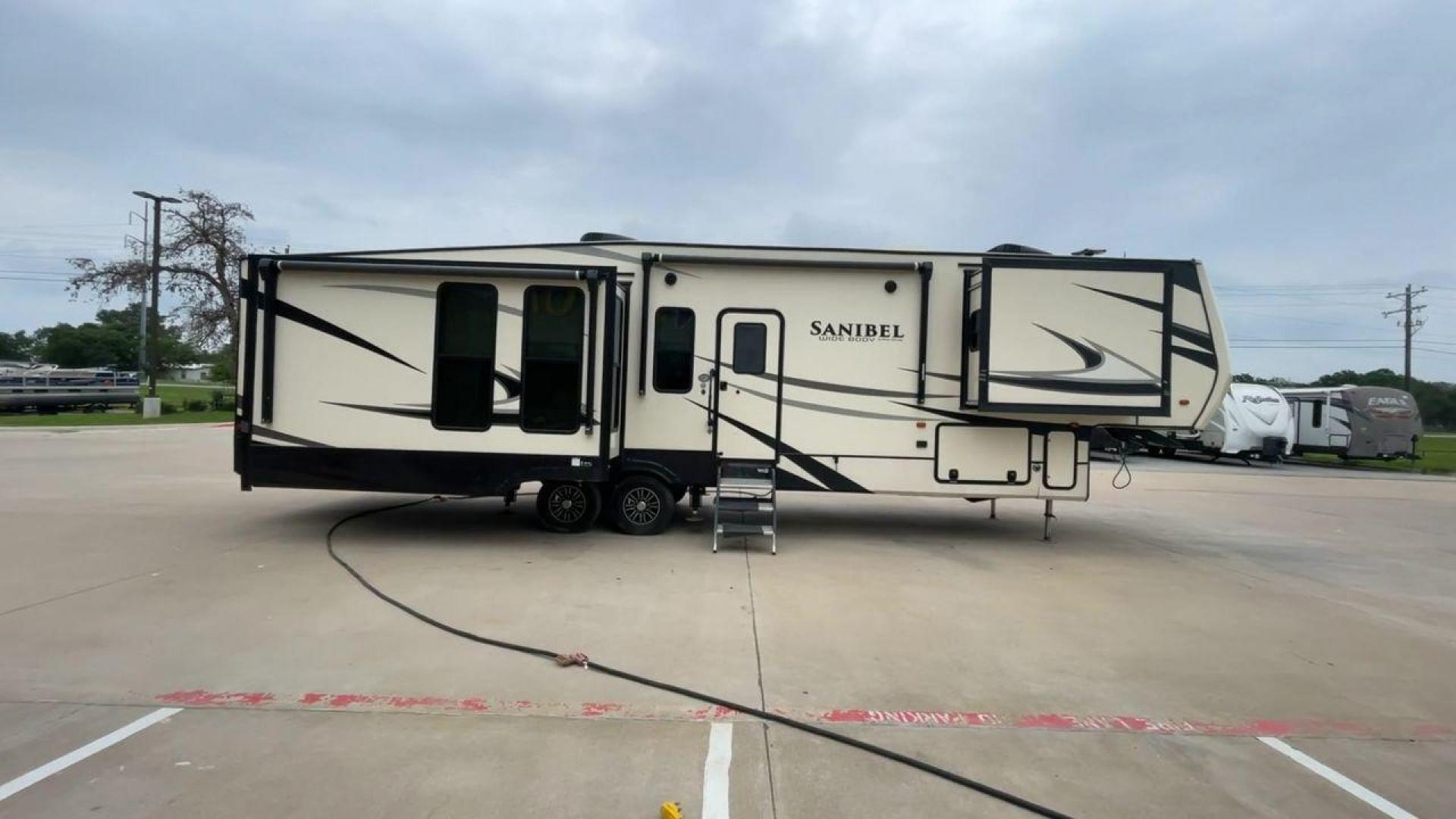 2019 TAN SANIBEL 3702WB (5ZT3SN2B6KG) , located at 4319 N Main Street, Cleburne, TX, 76033, (817) 221-0660, 32.435829, -97.384178 - The length of this 2019 Sanibel Fifth Wheel is just over 41 feet, and the width is just over 8 feet. It weighs 11,859 pounds when it's not hitched and 2,298 pounds when it is. The heater in this unit is listed at 40,000 BTUs, and it heats and cools itself automatically. This has a beautiful gray bas - Photo#2