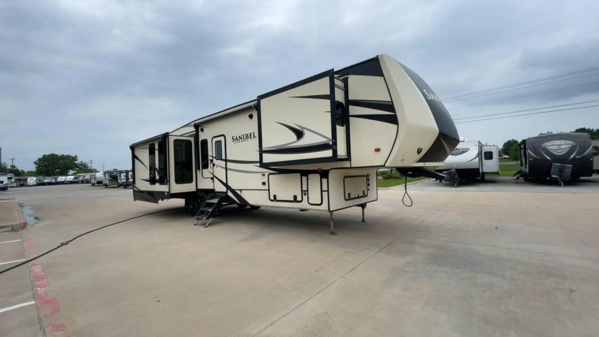 2019 TAN SANIBEL 3702WB (5ZT3SN2B6KG) , located at 4319 N Main Street, Cleburne, TX, 76033, (817) 221-0660, 32.435829, -97.384178 - The length of this 2019 Sanibel Fifth Wheel is just over 41 feet, and the width is just over 8 feet. It weighs 11,859 pounds when it's not hitched and 2,298 pounds when it is. The heater in this unit is listed at 40,000 BTUs, and it heats and cools itself automatically. This has a beautiful gray bas - Photo#3