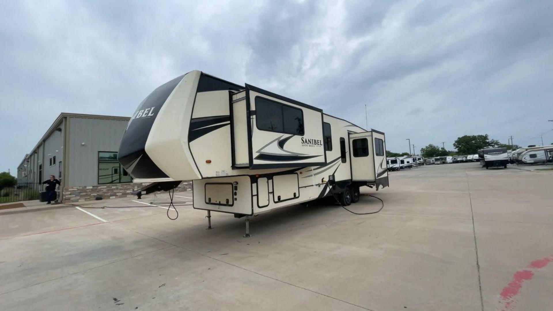 2019 TAN SANIBEL 3702WB (5ZT3SN2B6KG) , located at 4319 N Main Street, Cleburne, TX, 76033, (817) 221-0660, 32.435829, -97.384178 - The length of this 2019 Sanibel Fifth Wheel is just over 41 feet, and the width is just over 8 feet. It weighs 11,859 pounds when it's not hitched and 2,298 pounds when it is. The heater in this unit is listed at 40,000 BTUs, and it heats and cools itself automatically. This has a beautiful gray bas - Photo#5