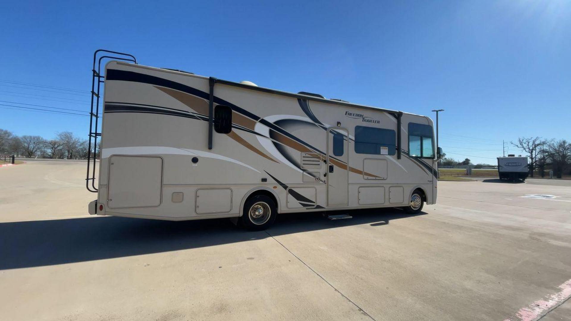 2019 THOR FREEDOM TRAVELER A30 (1F65F5DY1K0) , Length:31.75 ft. | Gross Weight: 18,000 lbs. | Slides: 1 transmission, located at 4319 N Main Street, Cleburne, TX, 76033, (817) 221-0660, 32.435829, -97.384178 - The 2019 Thor Freedom Traveler A30 is a sleek and modern travel trailer with an attractive beige exterior enhanced by dynamic swirls of gold, black, and white accents. Its single slide-out provides extra interior space when parked. The coach features large, tinted windows for ample natural light whi - Photo#1