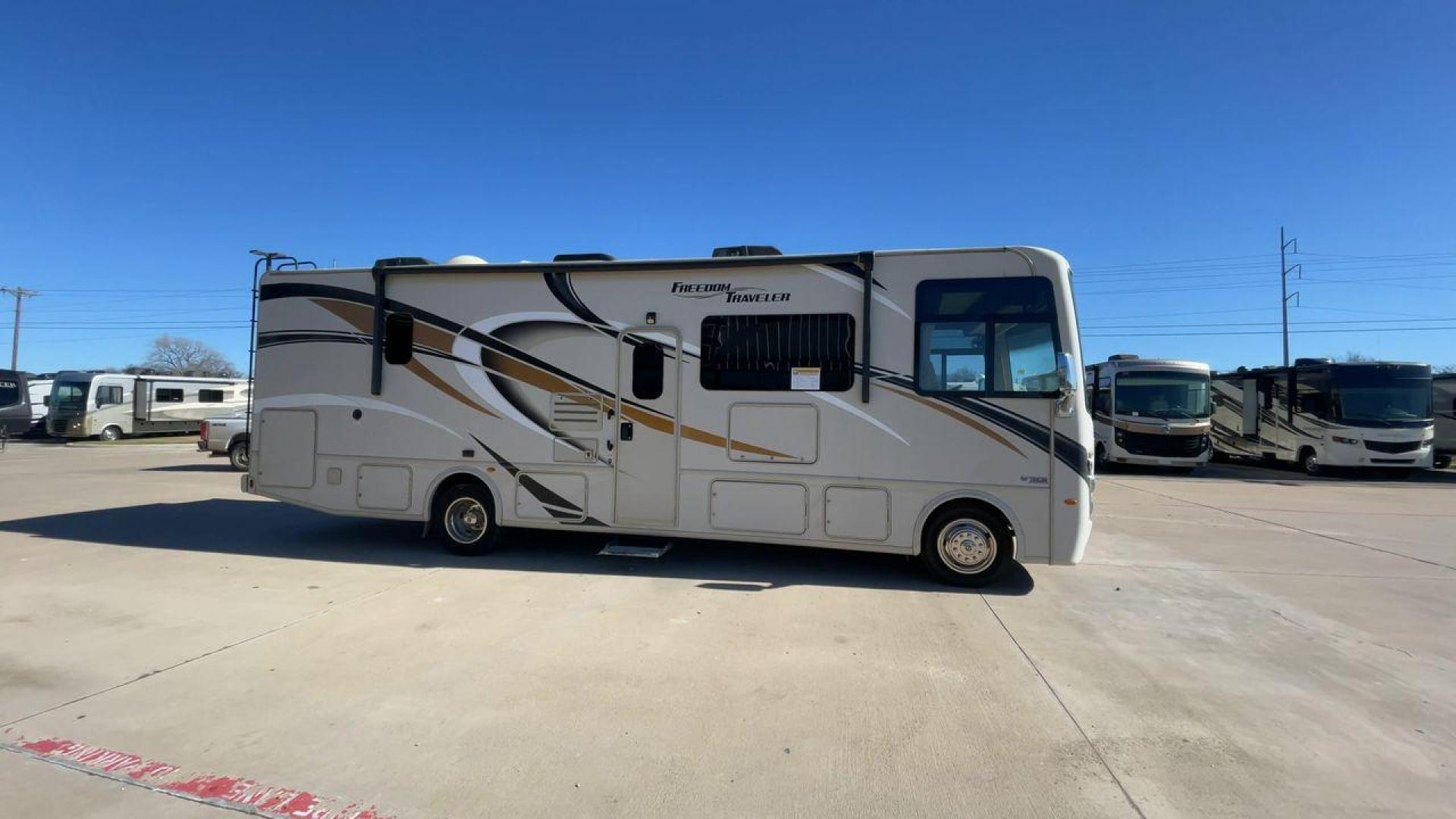 2019 THOR FREEDOM TRAVELER A30 (1F65F5DY1K0) , Length:31.75 ft. | Gross Weight: 18,000 lbs. | Slides: 1 transmission, located at 4319 N Main Street, Cleburne, TX, 76033, (817) 221-0660, 32.435829, -97.384178 - The 2019 Thor Freedom Traveler A30 is a sleek and modern travel trailer with an attractive beige exterior enhanced by dynamic swirls of gold, black, and white accents. Its single slide-out provides extra interior space when parked. The coach features large, tinted windows for ample natural light whi - Photo#2