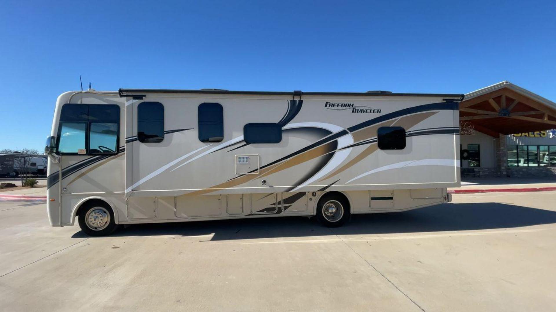 2019 THOR FREEDOM TRAVELER A30 (1F65F5DY1K0) , Length:31.75 ft. | Gross Weight: 18,000 lbs. | Slides: 1 transmission, located at 4319 N Main Street, Cleburne, TX, 76033, (817) 221-0660, 32.435829, -97.384178 - The 2019 Thor Freedom Traveler A30 is a sleek and modern travel trailer with an attractive beige exterior enhanced by dynamic swirls of gold, black, and white accents. Its single slide-out provides extra interior space when parked. The coach features large, tinted windows for ample natural light whi - Photo#6