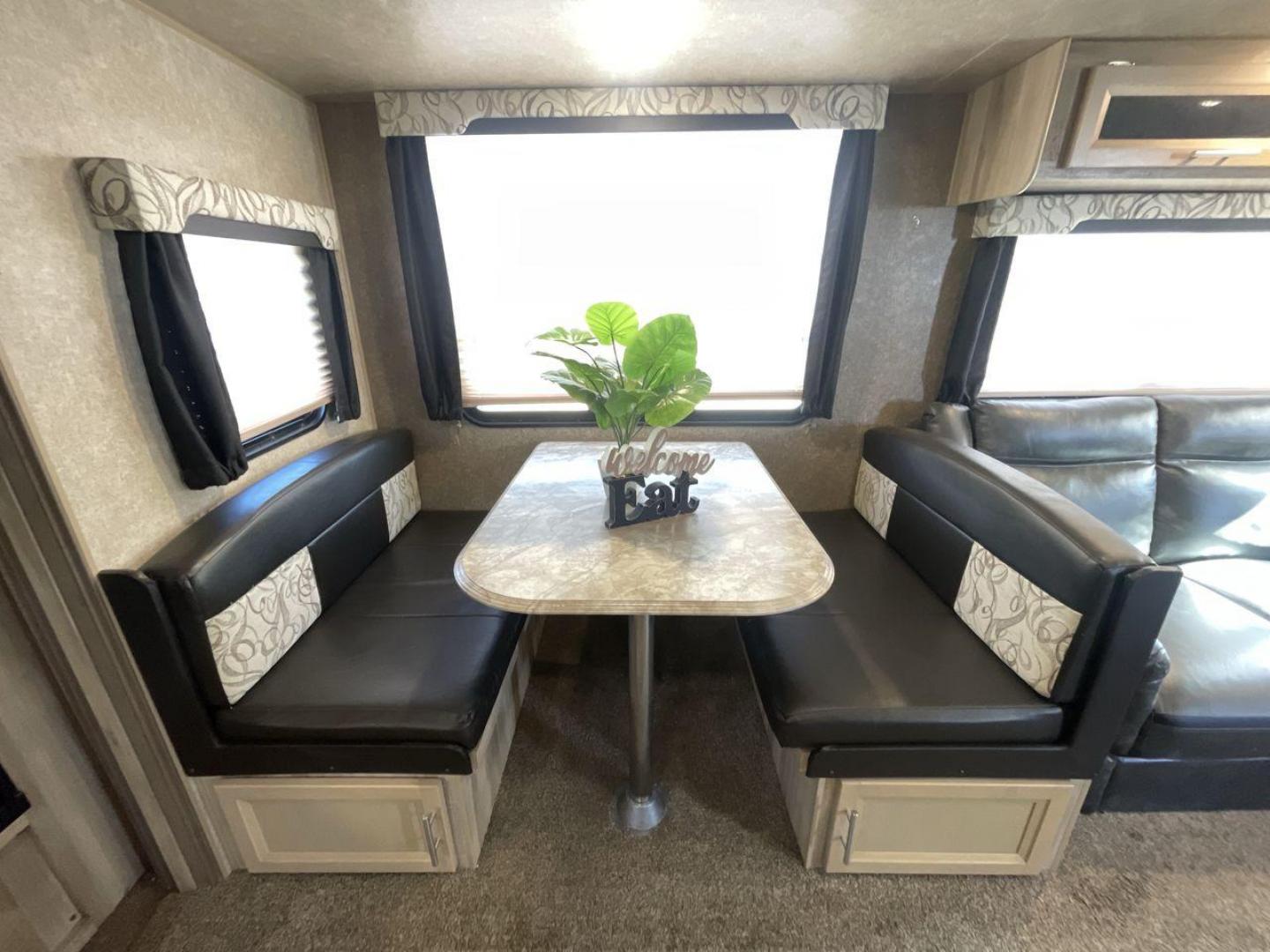 2020 COACHMEN CATALINA 303RKPLE (5ZT2CAVB4LX) , Length: 35.25 ft. | Dry Weight: 7,746 lbs. | Gross Weight: 9,800 lbs. | Slides: 1 transmission, located at 4319 N Main Street, Cleburne, TX, 76033, (817) 221-0660, 32.435829, -97.384178 - The 2020 Coachmen Catalina Legacy Edition is a spacious RV with a length of 35.25 feet. Its exteriors feature sleek, silver aluminum siding with blue and black accent decals. The RV has one large slideout that extends the living area. The front of the RV has a rounded nose with a dark rock guard pan - Photo#14