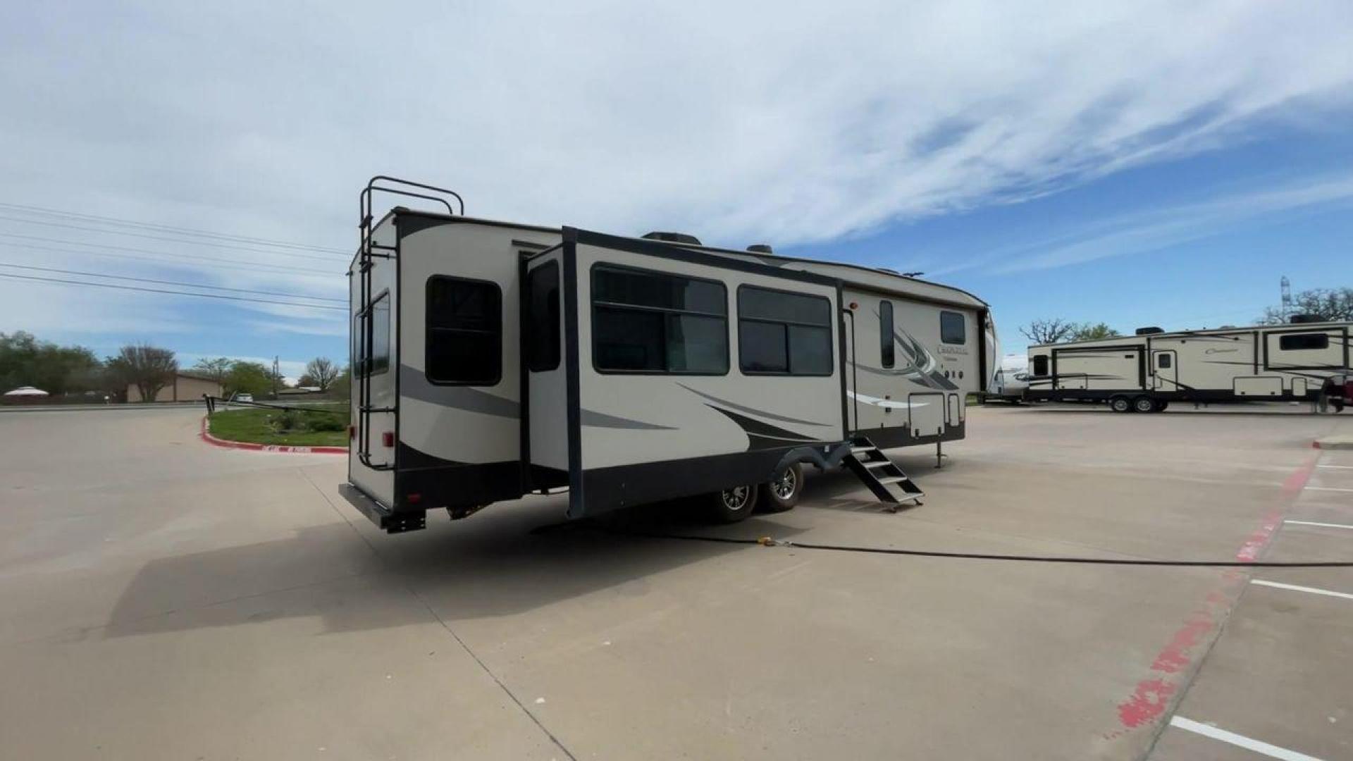 2020 FOREST RIVER CHAPARRAL 360IBL (5ZT3CH1B1LA) , Length: 39 ft. | Dry Weight: 11,450 lbs. | Gross Weight: 14,000 lbs. | Slides: 4 transmission, located at 4319 N Main Street, Cleburne, TX, 76033, (817) 221-0660, 32.435829, -97.384178 - With a length of 39 feet and a dry weight of 11,450 pounds, this spacious 2020 Coachmen Chaparral 360IBL offers plenty of room for the whole family and then some. The exterior is equipped with a massive 18-foot power awning, providing ample shade and protection from the elements while you relax outs - Photo#1