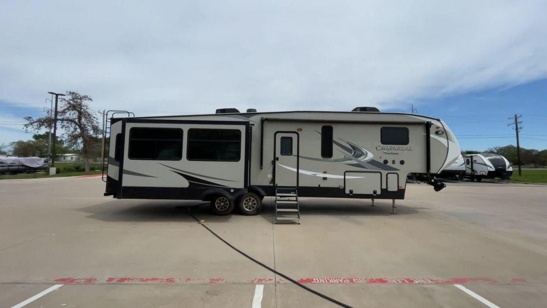 2020 FOREST RIVER CHAPARRAL 360IBL (5ZT3CH1B1LA) , Length: 39 ft. | Dry Weight: 11,450 lbs. | Gross Weight: 14,000 lbs. | Slides: 4 transmission, located at 4319 N Main Street, Cleburne, TX, 76033, (817) 221-0660, 32.435829, -97.384178 - With a length of 39 feet and a dry weight of 11,450 pounds, this spacious 2020 Coachmen Chaparral 360IBL offers plenty of room for the whole family and then some. The exterior is equipped with a massive 18-foot power awning, providing ample shade and protection from the elements while you relax outs - Photo#2