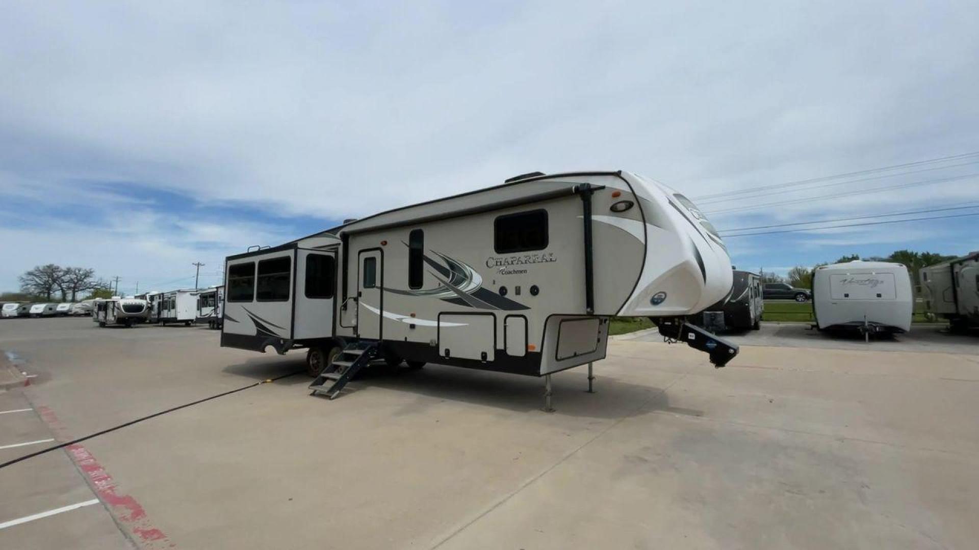 2020 FOREST RIVER CHAPARRAL 360IBL (5ZT3CH1B1LA) , Length: 39 ft. | Dry Weight: 11,450 lbs. | Gross Weight: 14,000 lbs. | Slides: 4 transmission, located at 4319 N Main Street, Cleburne, TX, 76033, (817) 221-0660, 32.435829, -97.384178 - With a length of 39 feet and a dry weight of 11,450 pounds, this spacious 2020 Coachmen Chaparral 360IBL offers plenty of room for the whole family and then some. The exterior is equipped with a massive 18-foot power awning, providing ample shade and protection from the elements while you relax outs - Photo#3