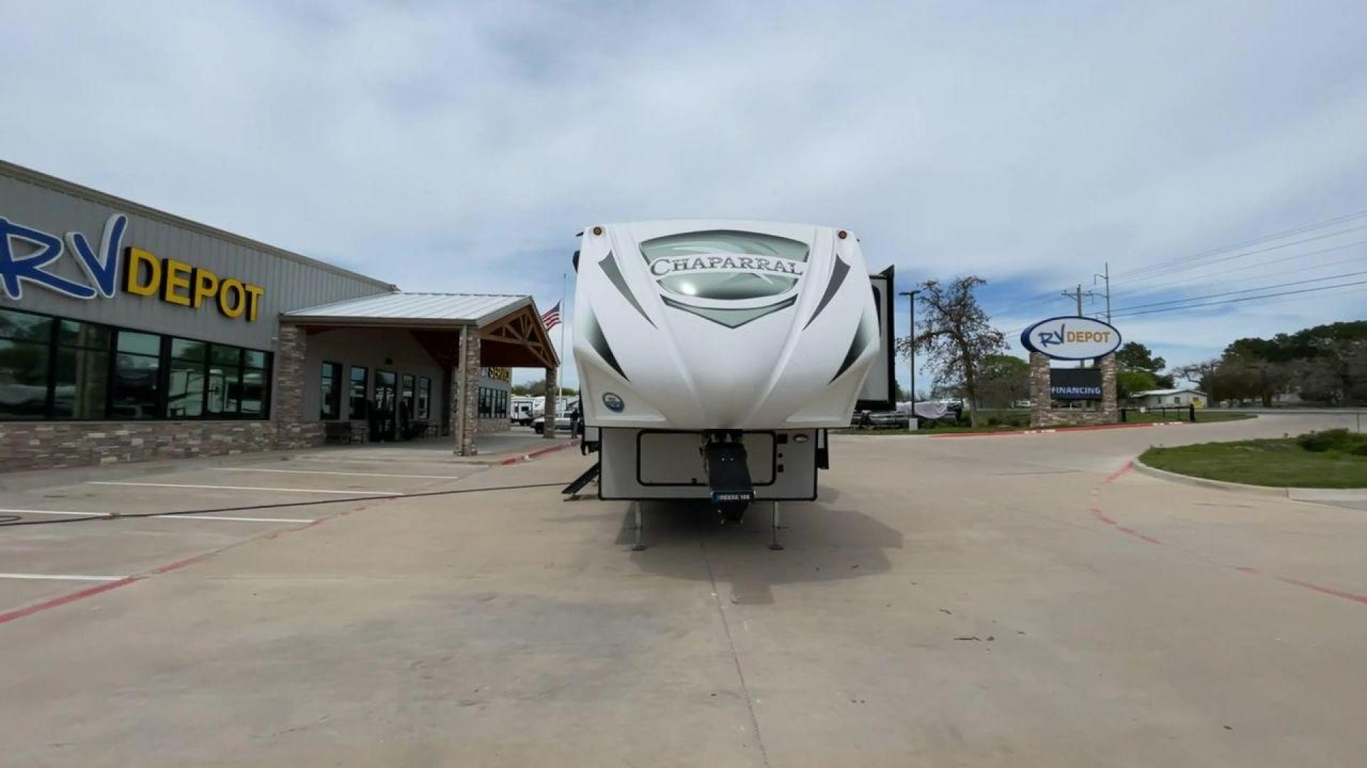 2020 FOREST RIVER CHAPARRAL 360IBL (5ZT3CH1B1LA) , Length: 39 ft. | Dry Weight: 11,450 lbs. | Gross Weight: 14,000 lbs. | Slides: 4 transmission, located at 4319 N Main Street, Cleburne, TX, 76033, (817) 221-0660, 32.435829, -97.384178 - With a length of 39 feet and a dry weight of 11,450 pounds, this spacious 2020 Coachmen Chaparral 360IBL offers plenty of room for the whole family and then some. The exterior is equipped with a massive 18-foot power awning, providing ample shade and protection from the elements while you relax outs - Photo#4