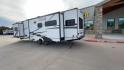 2020 FOREST RIVER FREEDOM EXPRESS (5ZT2FEXBXLW) , Length: 36.92 ft | Dry Weight: 8,328 lbs | Gross Weight: 10,500 lbs | Slides: 3 transmission, located at 4319 N Main Street, Cleburne, TX, 76033, (817) 221-0660, 32.435829, -97.384178 - The 2020 Freedom Express 324RLDS has a white body accented with sleek black and blue graphics, creating a stylish look. The front cap features an aerodynamic shape with bold design lines and a large tinted window. A sturdy electric tongue jack is positioned at the hitch for easy adjustments, complem - Photo#7