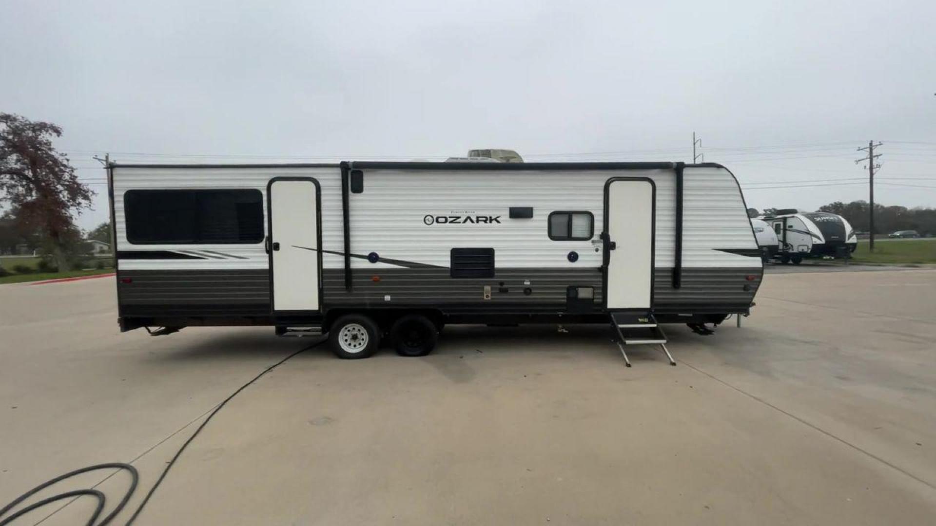 2020 FOREST RIVER OZARK 2700TH (4X4TZKC24LY) , Length:32.33 ft | Dry Weight: 5,683 lbs. | Gross Weight: 7,830 lbs. | Slides: 1 transmission, located at 4319 N Main Street, Cleburne, TX, 76033, (817) 221-0660, 32.435829, -97.384178 - Discover the ultimate in versatility with the 2020 Forest River Ozark 2700TH. This toy hauler travel trailer is expertly crafted to satisfy your adventurous side while providing unparalleled comfort. This model is designed to strike the perfect balance between spaciousness and maneuverability. With - Photo#2