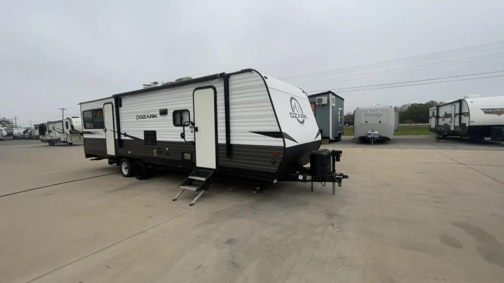 2020 FOREST RIVER OZARK 2700TH (4X4TZKC24LY) , Length:32.33 ft | Dry Weight: 5,683 lbs. | Gross Weight: 7,830 lbs. | Slides: 1 transmission, located at 4319 N Main Street, Cleburne, TX, 76033, (817) 221-0660, 32.435829, -97.384178 - Discover the ultimate in versatility with the 2020 Forest River Ozark 2700TH. This toy hauler travel trailer is expertly crafted to satisfy your adventurous side while providing unparalleled comfort. This model is designed to strike the perfect balance between spaciousness and maneuverability. With - Photo#3