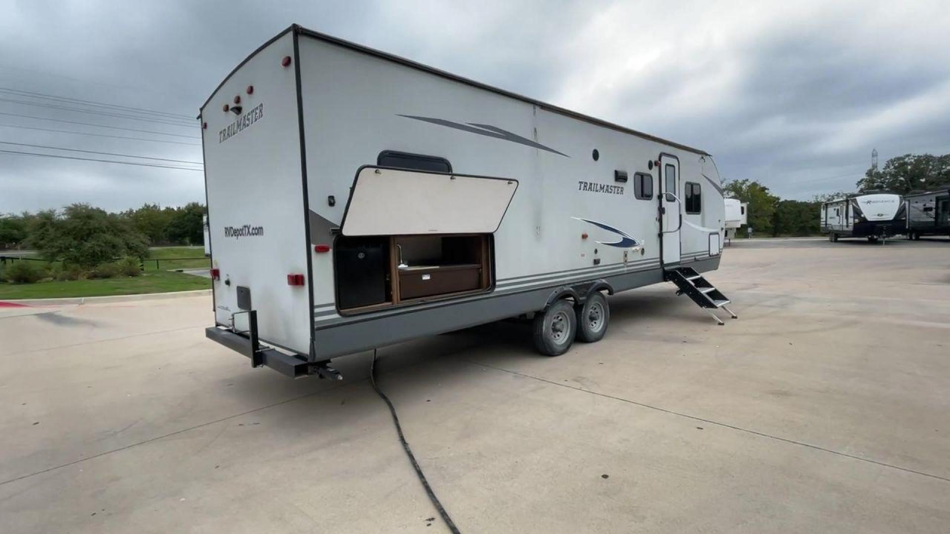 2020 WHITE GULFSTREAM TRAILMASTER 301TB (1NL1G3425L1) , Length: 34.08 ft. | Dry Weight: 6,845 lbs. | Slides: 1 transmission, located at 4319 N Main Street, Cleburne, TX, 76033, (817) 221-0660, 32.435829, -97.384178 - This 2020 Gulf Stream Trailmaster 301TB travel trailer measures 34.01 feet. There are two axles with steel wheels and electric drum brakes. Its dry weight is 6,845 lbs, its payload is 2,840 lbs, and its hitch is 885 lbs. The aluminum walls are painted gray with white and dark gray graphics. The 13,5 - Photo#1