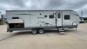 2020 WHITE GULFSTREAM TRAILMASTER 301TB (1NL1G3425L1) , Length: 34.08 ft. | Dry Weight: 6,845 lbs. | Slides: 1 transmission, located at 4319 N Main Street, Cleburne, TX, 76033, (817) 221-0660, 32.435829, -97.384178 - This 2020 Gulf Stream Trailmaster 301TB travel trailer measures 34.01 feet. There are two axles with steel wheels and electric drum brakes. Its dry weight is 6,845 lbs, its payload is 2,840 lbs, and its hitch is 885 lbs. The aluminum walls are painted gray with white and dark gray graphics. The 13,5 - Photo#2