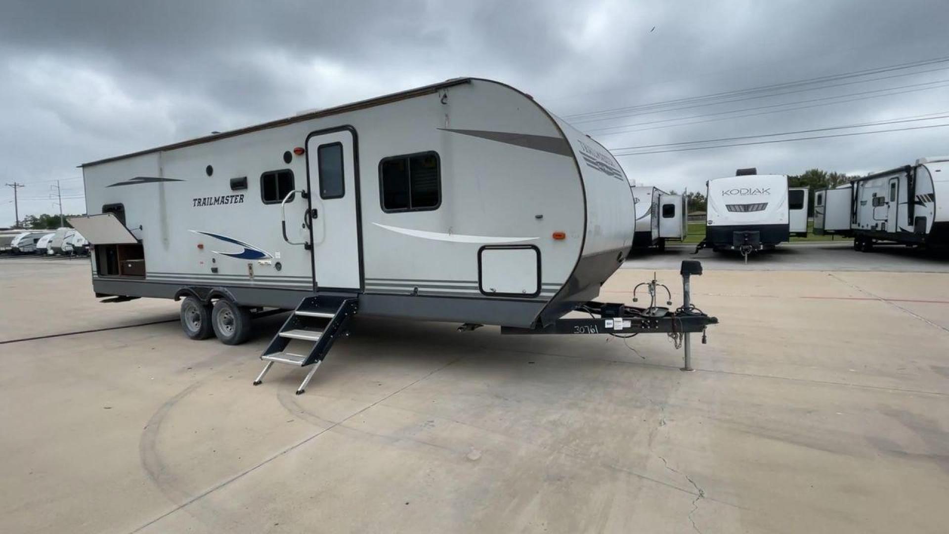 2020 WHITE GULFSTREAM TRAILMASTER 301TB (1NL1G3425L1) , Length: 34.08 ft. | Dry Weight: 6,845 lbs. | Slides: 1 transmission, located at 4319 N Main Street, Cleburne, TX, 76033, (817) 221-0660, 32.435829, -97.384178 - This 2020 Gulf Stream Trailmaster 301TB travel trailer measures 34.01 feet. There are two axles with steel wheels and electric drum brakes. Its dry weight is 6,845 lbs, its payload is 2,840 lbs, and its hitch is 885 lbs. The aluminum walls are painted gray with white and dark gray graphics. The 13,5 - Photo#3