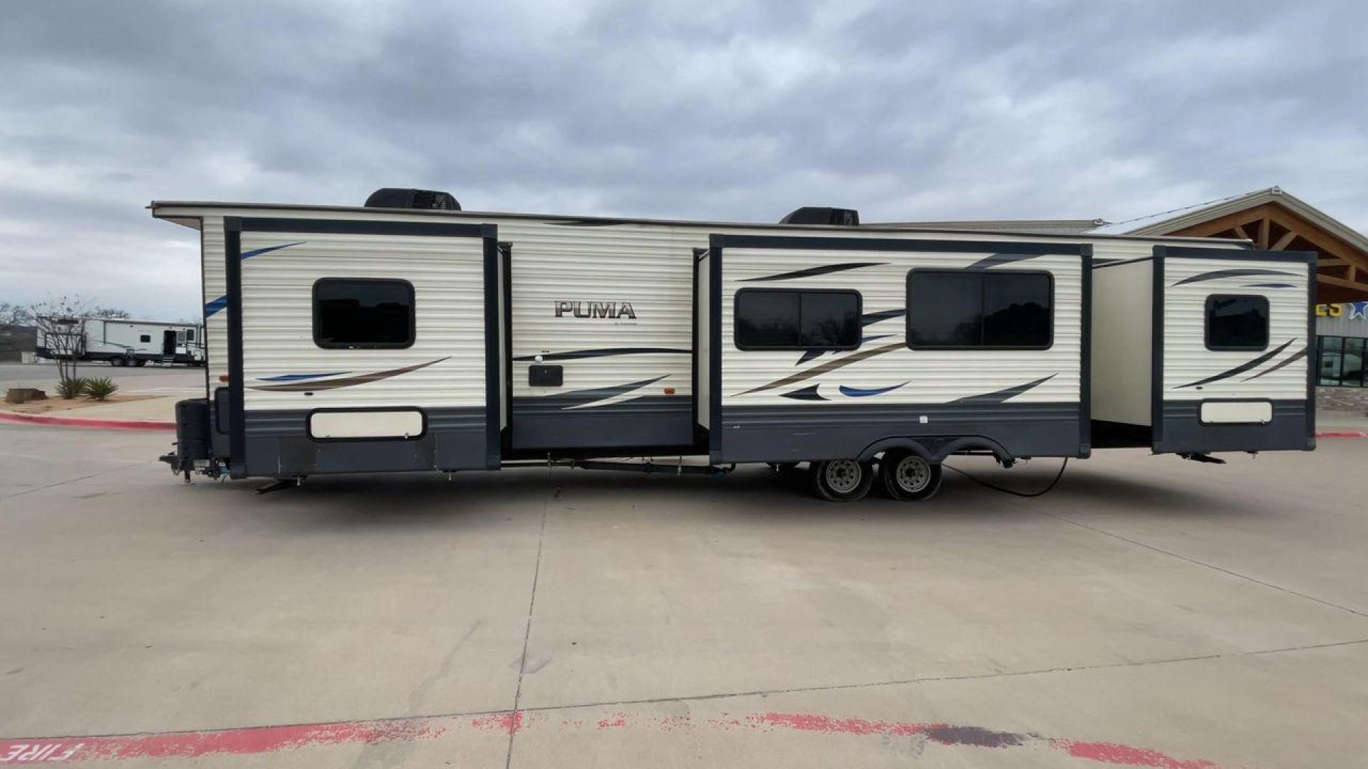 2020 NV DIGIL PUMA 38DBS - (4X4TPUP27LP) , Length: 41.92 ft | Dry Weight: 9,748 lbs. | Gross Weight: 11,522 lbs. | Slides: 3. transmission, located at 4319 N Main Street, Cleburne, TX, 76033, (817) 221-0660, 32.435829, -97.384178 - With its impressive features and unbeatable price of $38,995, this RV is sure to make your road trip dreams come true. The 2020 Puma 38DBS is a spacious and stylish travel trailer designed for both comfort and functionality. Its exterior features a striking combination of cream and gray tones with s - Photo#6