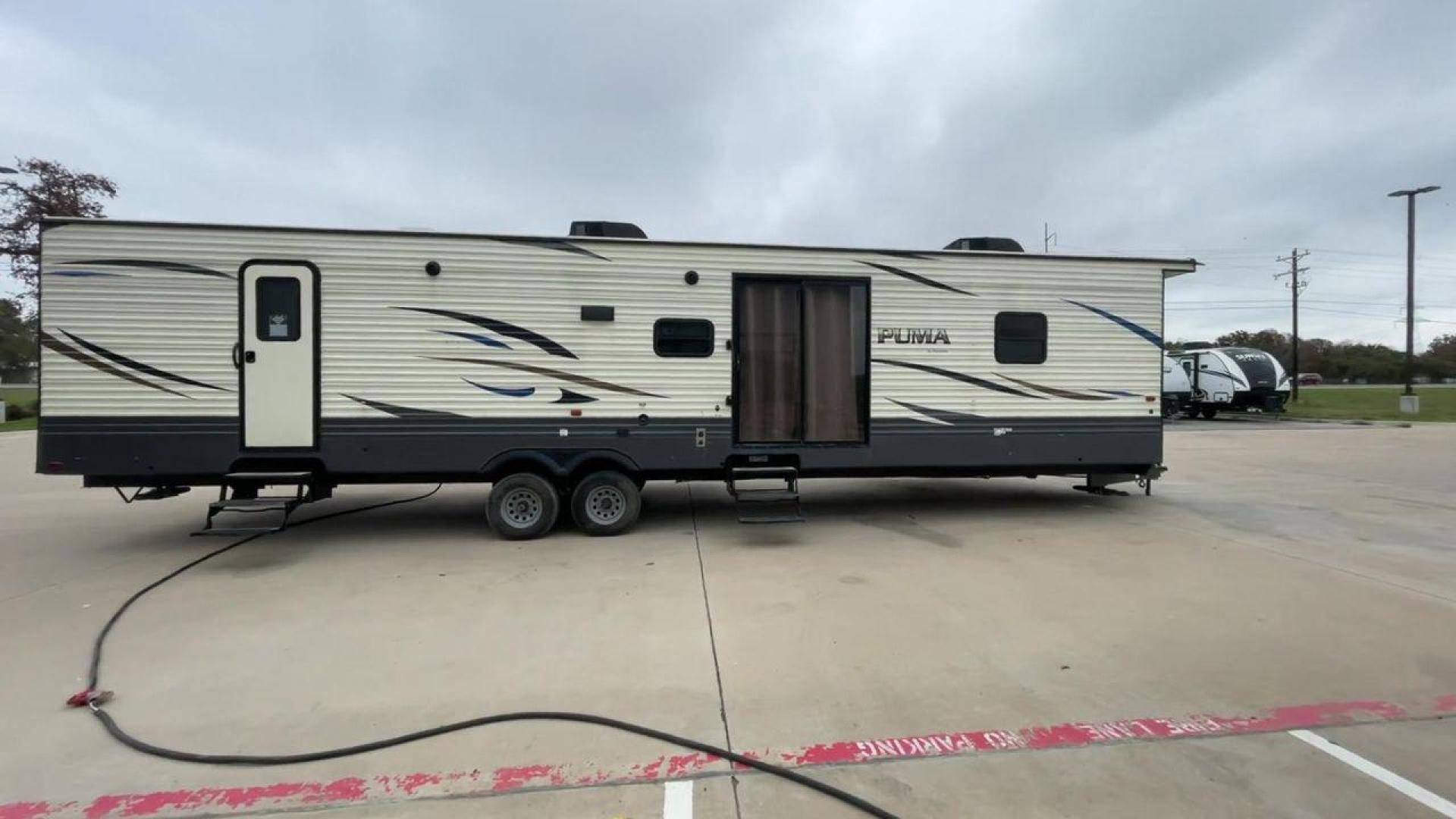 2020 PUMA 38DBS - (4X4TPUP26LP) , located at 4319 N Main Street, Cleburne, TX, 76033, (817) 221-0660, 32.435829, -97.384178 - Are you looking for a spacious and comfortable travel trailer bunk house to explore the local driving highlights around Cleburne, TX? Look no further than this 2020 PUMA 38DBS, available for sale at RV Depot in Cleburne, TX. With its impressive features and affordable price of $38,995, this travel t - Photo#2