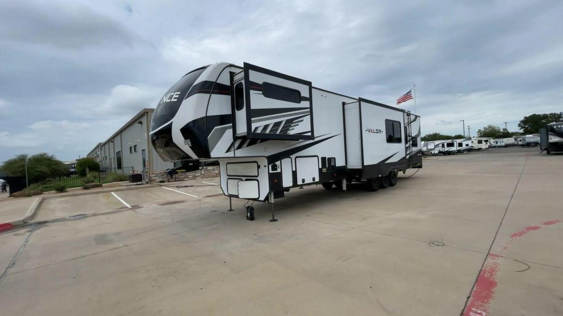 2021 ALLIANCE VALOR 42V13 (7M5FV4533MA) , Length: 44.08 ft. | Dry Weight: 16,064 lbs. | Gross Weight: 20,000 lbs. | Slides: 3 transmission, located at 4319 N Main Street, Cleburne, TX, 76033, (817) 221-0660, 32.435829, -97.384178 - The Valor 42V13 features a striking modern exterior with clean lines, highlighted by its sleek black, white, and gray color scheme. The multiple slide-outs (3) enhance interior space, while the large windows offer plenty of natural light. The rear garage entry has a ramp door for easy loading of rec - Photo#5