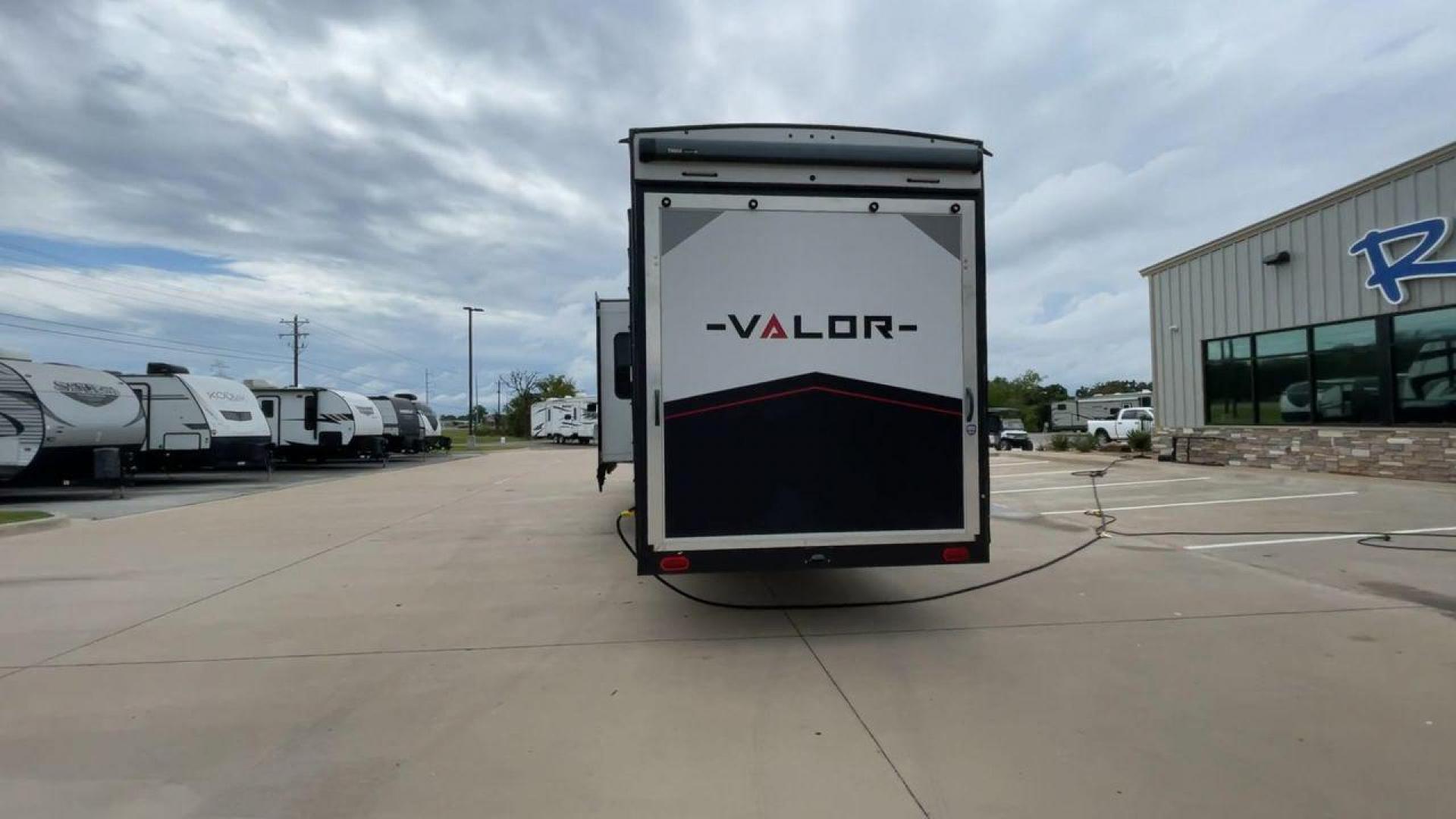 2021 ALLIANCE VALOR 42V13 (7M5FV4533MA) , Length: 44.08 ft. | Dry Weight: 16,064 lbs. | Gross Weight: 20,000 lbs. | Slides: 3 transmission, located at 4319 N Main Street, Cleburne, TX, 76033, (817) 221-0660, 32.435829, -97.384178 - The Valor 42V13 features a striking modern exterior with clean lines, highlighted by its sleek black, white, and gray color scheme. The multiple slide-outs (3) enhance interior space, while the large windows offer plenty of natural light. The rear garage entry has a ramp door for easy loading of rec - Photo#8