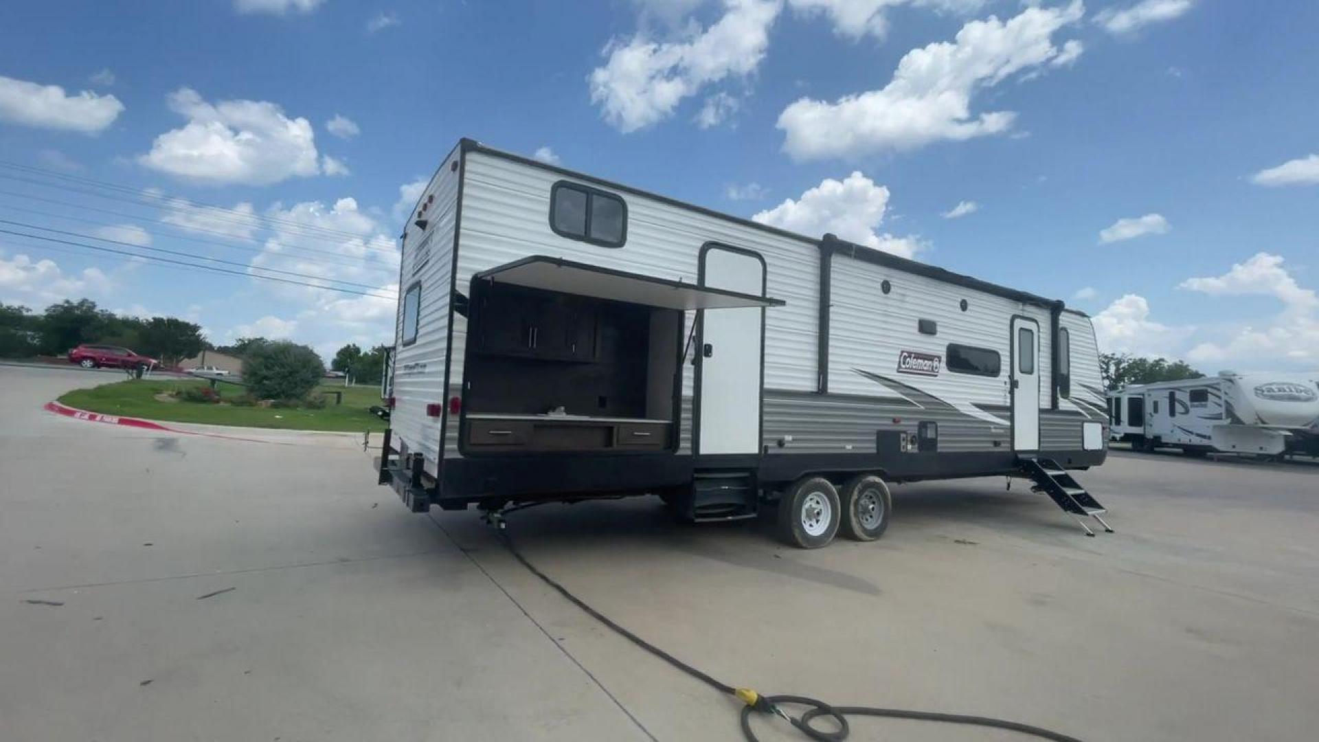 2021 WHITE DUTCHMEN COLEMAN 334BH (4YDT3342XMH) , Length: 37.25 ft. | Dry Weight: 7,806 lbs. | Slides: 2 transmission, located at 4319 N Main Street, Cleburne, TX, 76033, (817) 221-0660, 32.435829, -97.384178 - The 2021 Dutchmen Coleman 334BH is a luxurious and spacious travel trailer designed to redefine your camping experience. Its exterior boasts a length of 37 feet, a width of 8 feet, and a dry weight of 7,806 lbs. The aluminum frame construction ensures durability and lightweight towing, while the hig - Photo#1