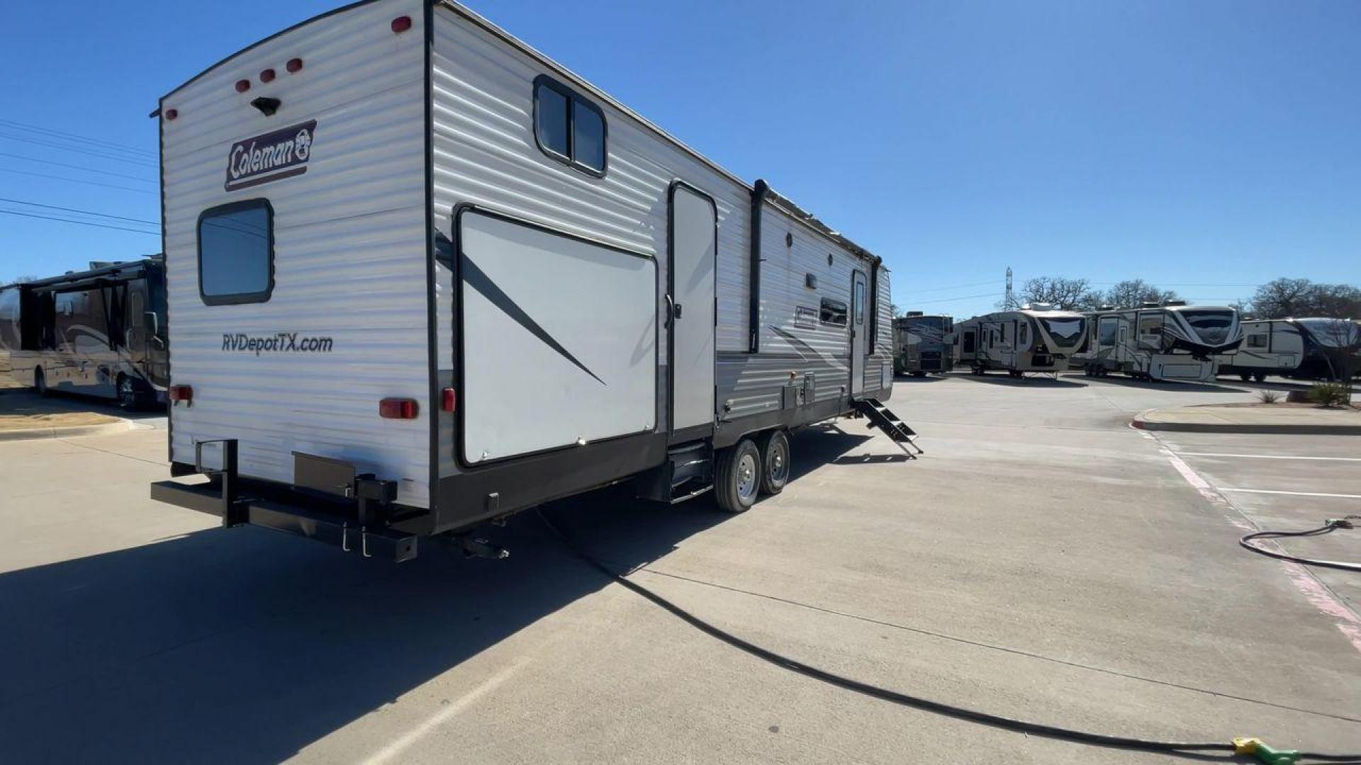 2021 WHITE DUTCHMEN COLEMAN 334BH (4YDT3342XMH) , Length: 37.25 ft. | Dry Weight: 7,806 lbs. | Slides: 2 transmission, located at 4319 N Main Street, Cleburne, TX, 76033, (817) 221-0660, 32.435829, -97.384178 - The 2021 Dutchmen Coleman 334BH is a luxurious and spacious travel trailer designed to redefine your camping experience. Its exterior boasts a length of 37 feet, a width of 8 feet, and a dry weight of 7,806 lbs. The aluminum frame construction ensures durability and lightweight towing, while the hig - Photo#1