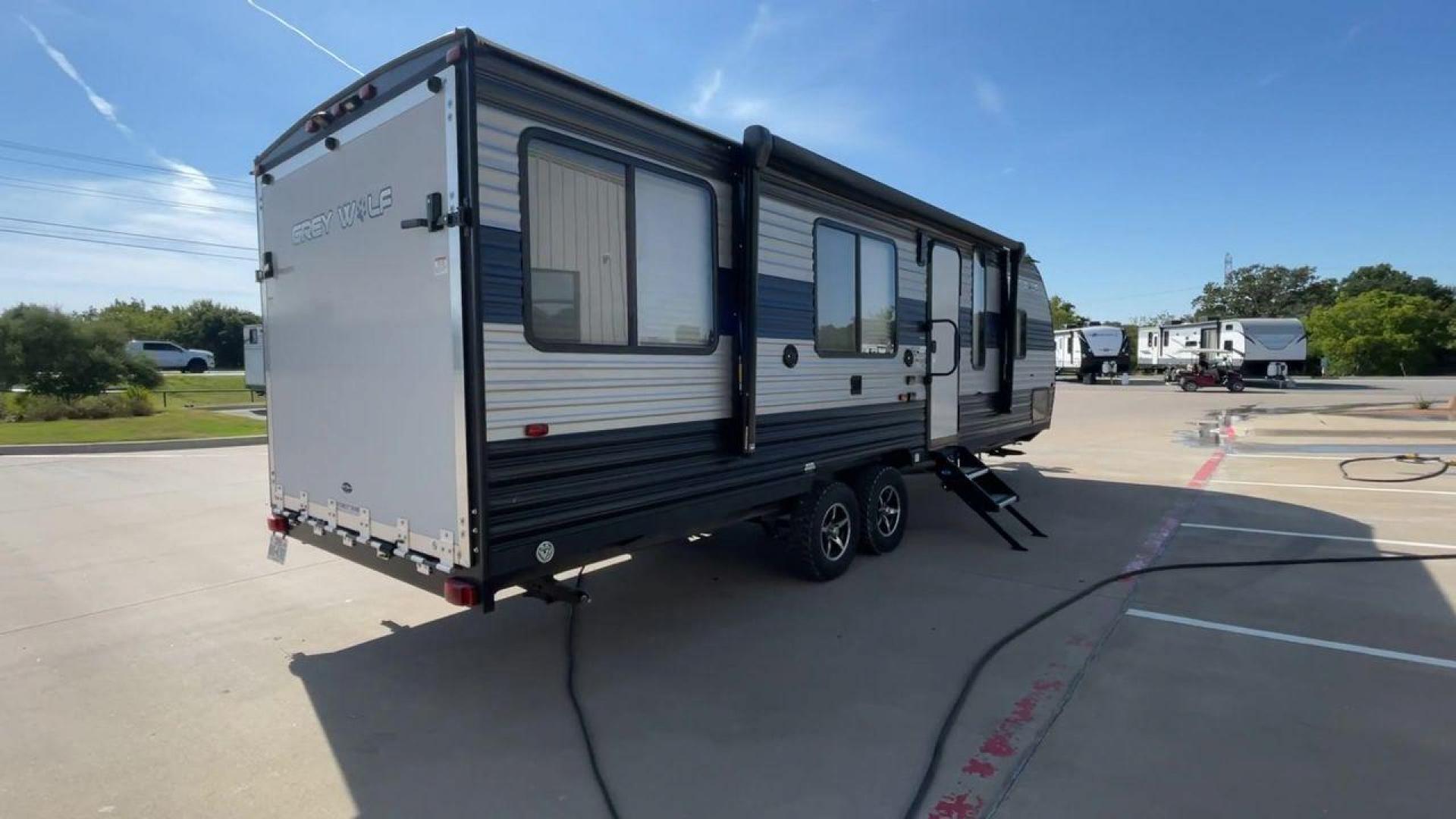 2021 FOREST RIVER GREY WOLF 25RRT (4X4TCKA22MK) , Length: 30.83 ft. | Dry Weight: 5,103 lbs. | Gross Weight: 7,690 lbs. | Slides: 0 transmission, located at 4319 N Main Street, Cleburne, TX, 76033, (817) 221-0660, 32.435829, -97.384178 - Hop on this 2021 Forest River Grey Wolf 25RRT and prepare for some of your life's best adventures! This toy hauler measures 30.83 ft. in length and 10.5 ft. in height. It has a dry weight of 5,103 lbs. and a GVWR of 7,690 lbs. Its exterior is a base color of gray with black and navy blue accents. Th - Photo#1