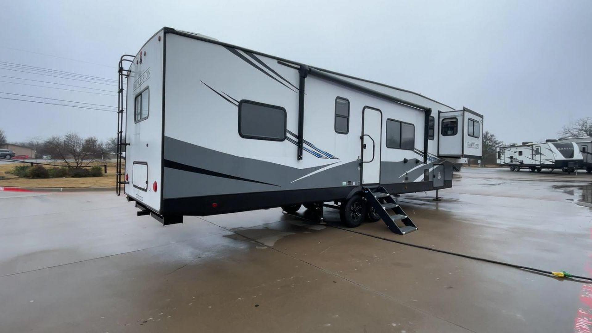 2021 FOREST RIVER IMPRESSION 320FL (5ZT3MPXB1MD) , Length: 40.17 ft | Dry Weight: 10,303 lbs | Gross Weight: 14,535 lbs | Slides: 4 transmission, located at 4319 N Main Street, Cleburne, TX, 76033, (817) 221-0660, 32.435829, -97.384178 - The 2021 Forest River Impression 320FL fifth wheel RV is built for durability and style. Its sleek white fiberglass body is accented with bold black and blue graphics, giving it a modern and aerodynamic look. The front cap features a distinctive aerodynamic profile with the Impression logo prominent - Photo#1