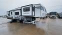 2021 FOREST RIVER IMPRESSION 320FL (5ZT3MPXB1MD) , Length: 40.17 ft | Dry Weight: 10,303 lbs | Gross Weight: 14,535 lbs | Slides: 4 transmission, located at 4319 N Main Street, Cleburne, TX, 76033, (817) 221-0660, 32.435829, -97.384178 - The 2021 Forest River Impression 320FL fifth wheel RV is built for durability and style. Its sleek white fiberglass body is accented with bold black and blue graphics, giving it a modern and aerodynamic look. The front cap features a distinctive aerodynamic profile with the Impression logo prominent - Photo#3