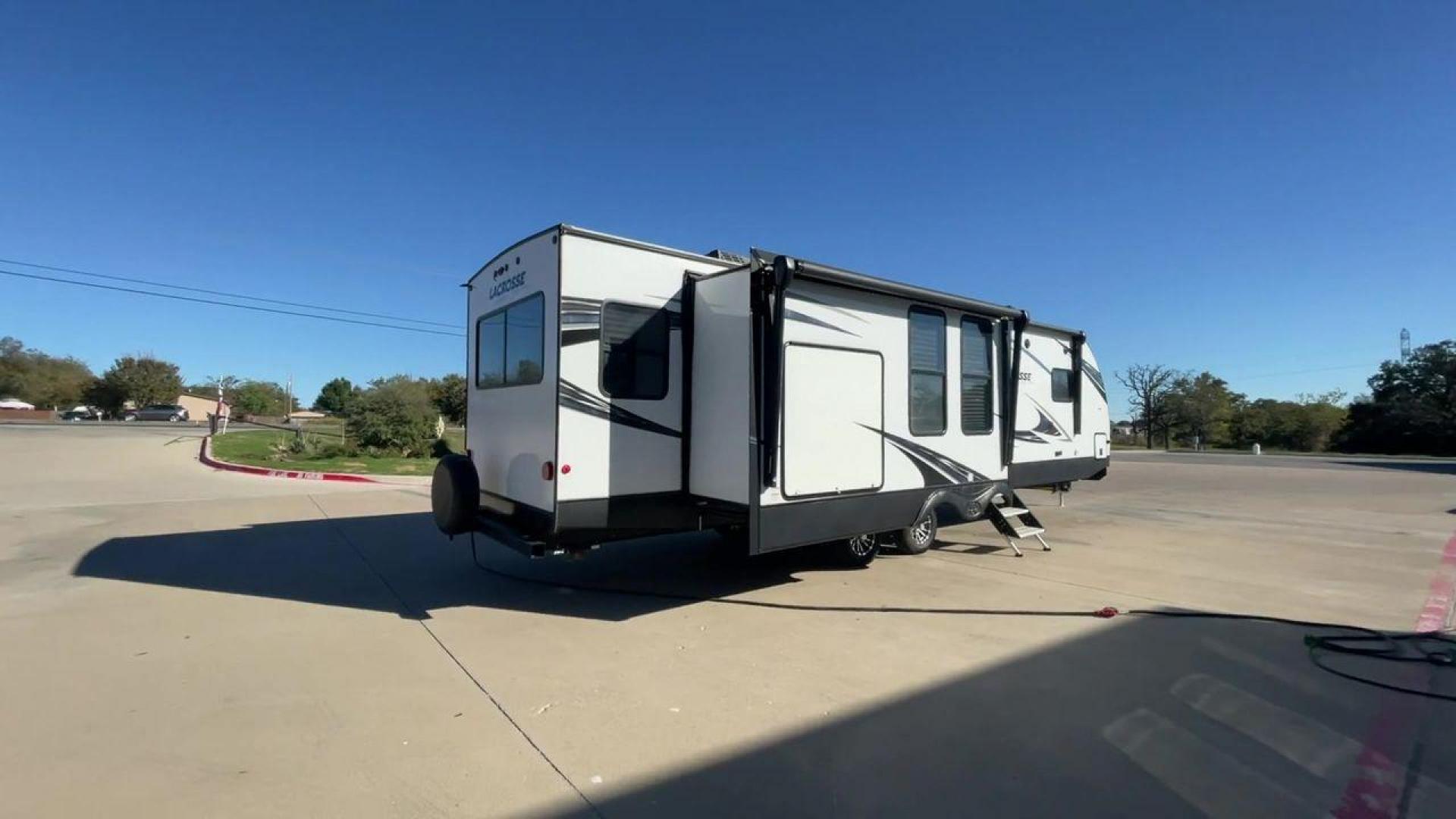 2021 FOREST RIVER LACROSSE 3399SE (5ZT2LCZB5MB) , Length: 37.58 ft. | Dry Weight: 8,678 lbs. | Slides: 3 transmission, located at 4319 N Main Street, Cleburne, TX, 76033, (817) 221-0660, 32.435829, -97.384178 - The 2021 Forest River LaCrosse 3399SE is a stunning travel trailer that seamlessly combines elegance with functionality. With a length of 37.58 feet, a dry weight of 8,678 lbs, and three slides, this model offers a spacious and well-balanced interior for a luxurious camping experience. The large kit - Photo#1